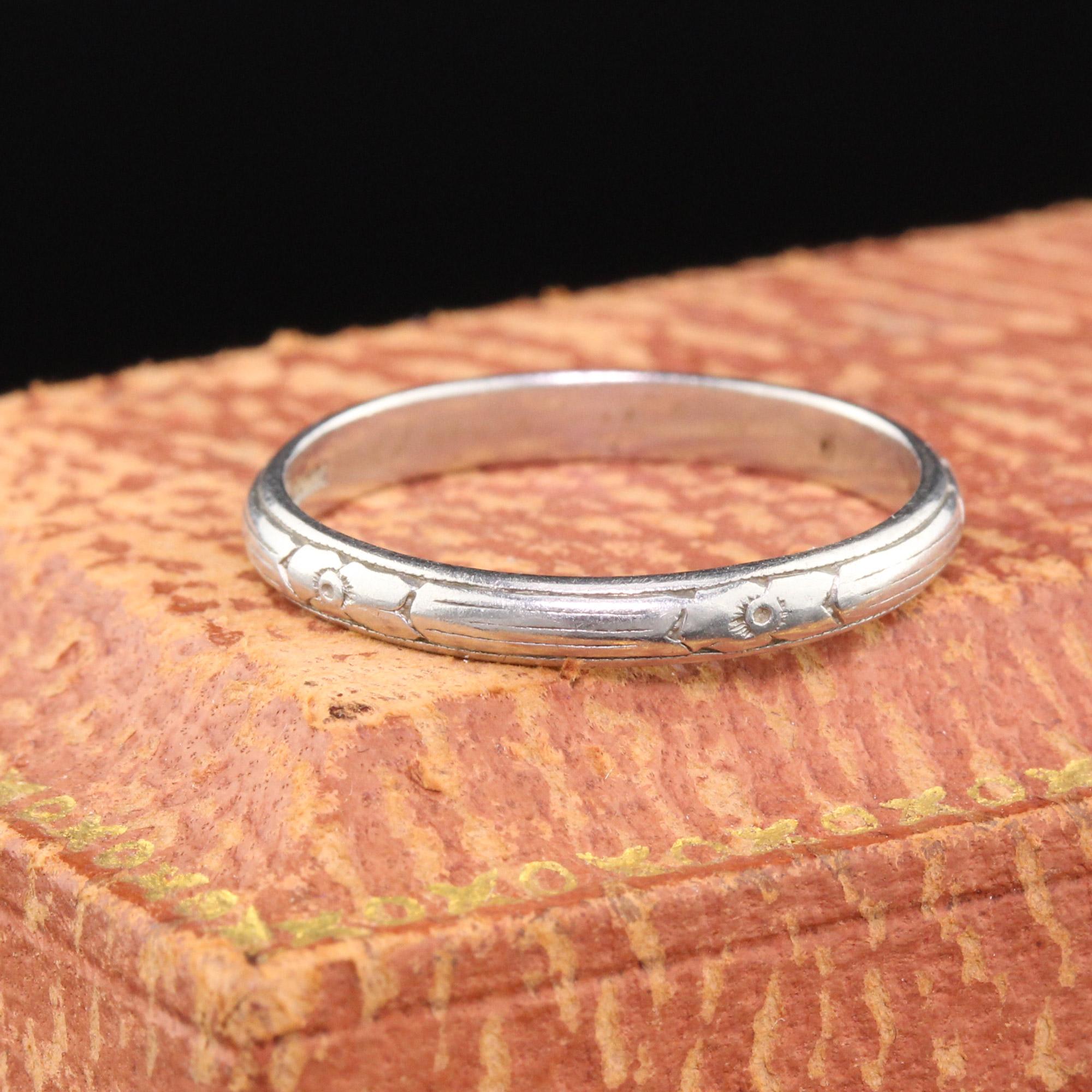 Art Deco platinum wedding band with engravings.

#R0220

Metal: Platinum

Weight: 2.9 Grams

Ring Size: 6 1/4 (sizable)

This ring can be sized for a $30 fee!

*Please note that we cannot accept returns on sized rings.

Measurements: 2.47 mm