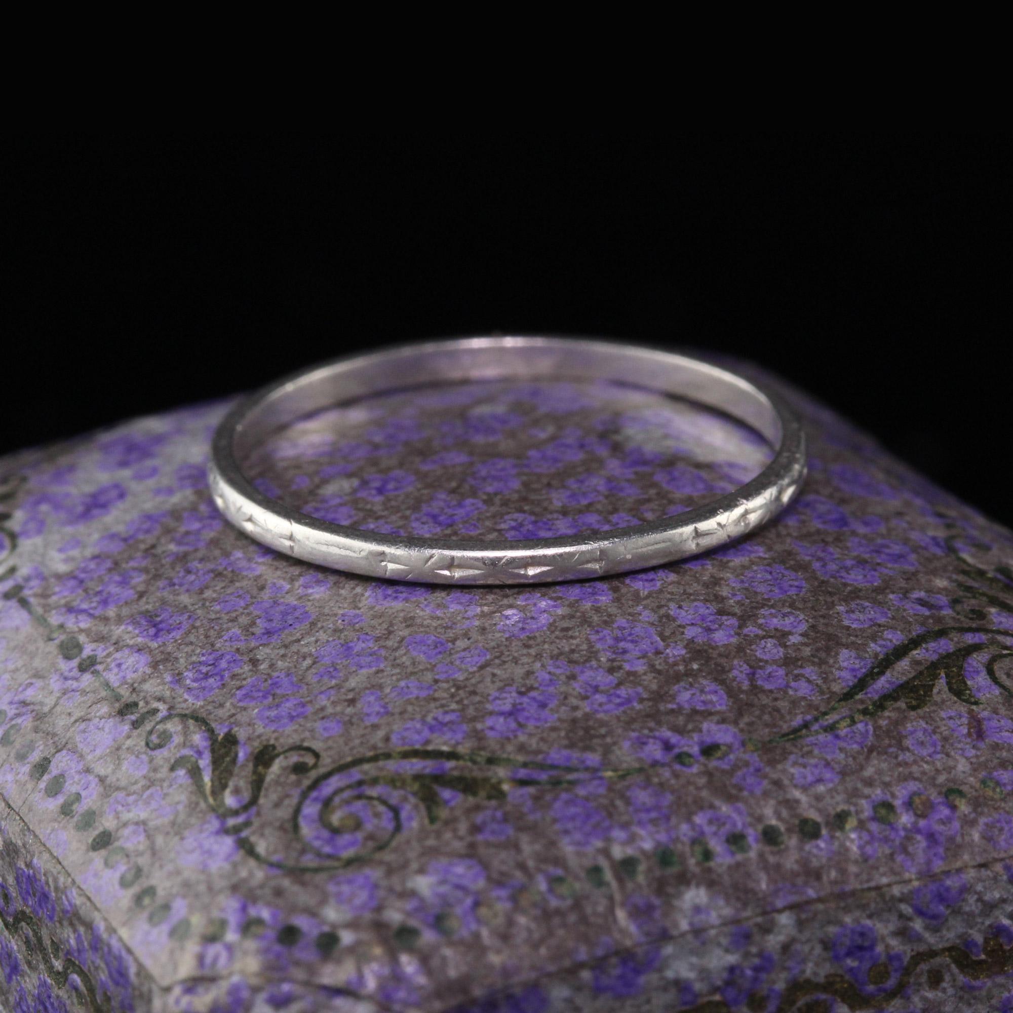 This is a classic Antique Art Deco Platinum Engraved Wedding Band. The band is in good condition. It is very dainty and can be stacked with other rings.

#R0132

Metal: Platinum

Weight: 1.3 Grams

Ring Size: 6 1/2 (sizable)

This ring can be sized