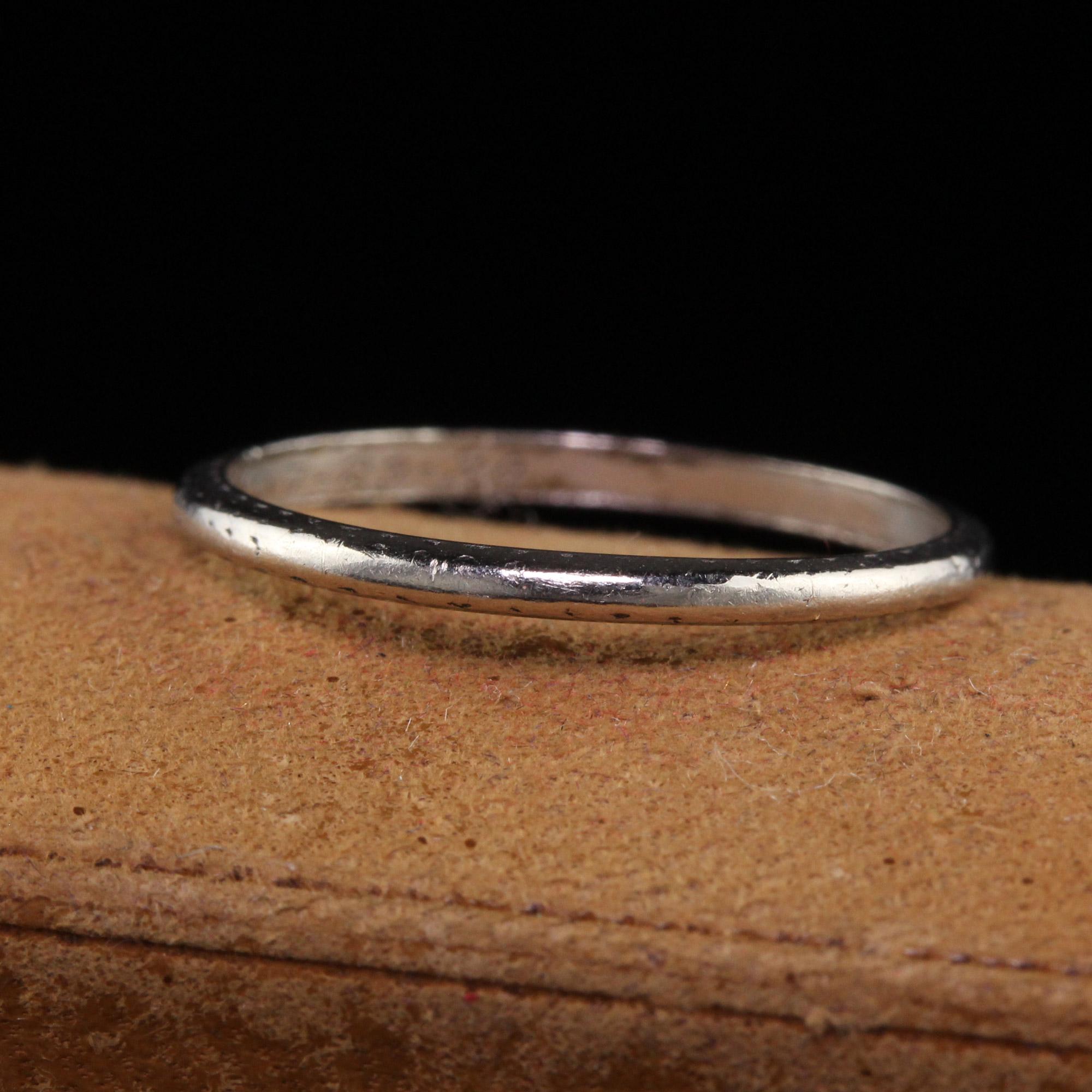 Beautiful Antique Art Deco Platinum Engraved Wedding Band - Size 5 1/4. This classic wedding band is crafted in platinum. The sides of the wedding band are faintly engraved and can be stacked with other thin bands. The ring is in good condition and