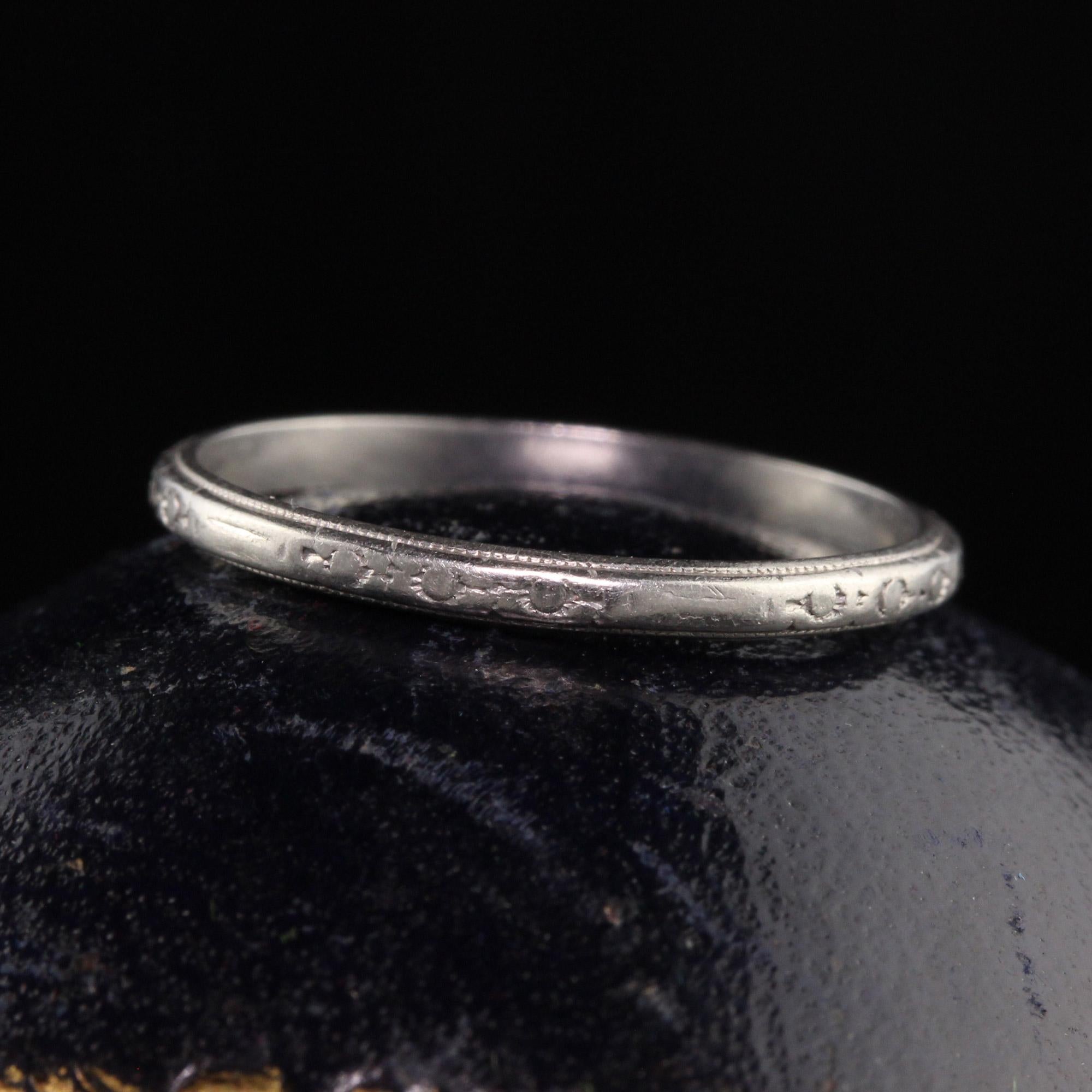 Beautiful Antique Art Deco Platinum Engraved Wedding Band - Size 7 1/2. This classic wedding band has nice engravings going around the entire ring. It is in great condition and can be stacked with other bands as well.

Item #R1024

Metal: