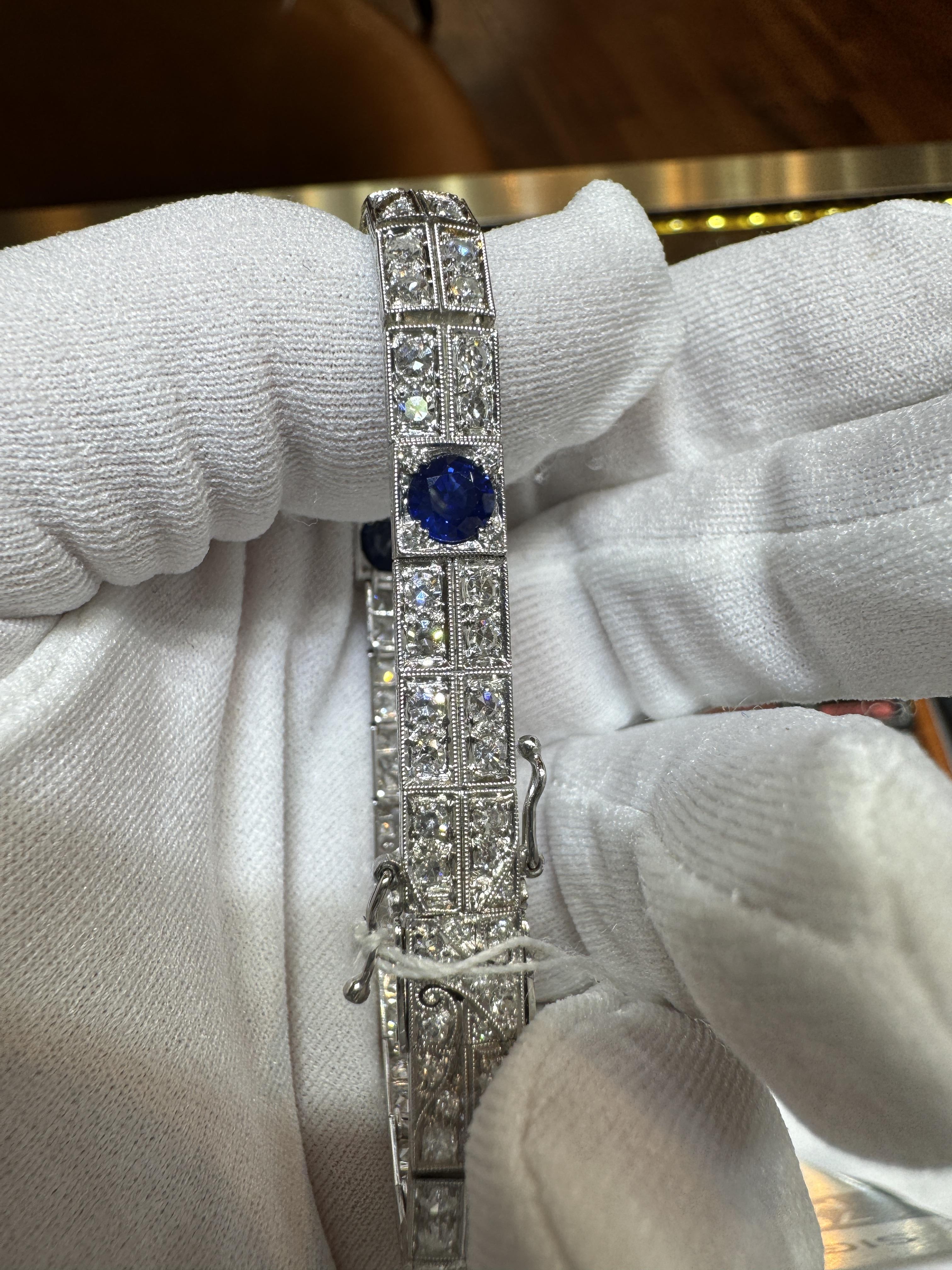 Hermann Marcus Signed Antique Art Deco Blue Sapphire and Diamond Bracelet in Platinum.  

Featuring 3 round cut blue sapphires and 118 round cut diamonds, made with a stunning and superbly detailed filigree setting on platinum. A quintessentially