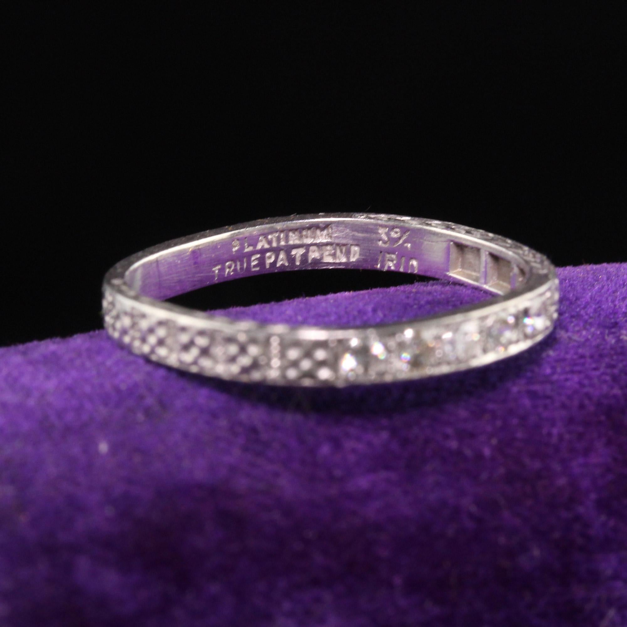 A Gorgeous Antique Art Deco Platinum Five Diamond Engraved Wedding Band - Size 6 1/4. This beautiful band has an interesting squarish shape. It is 100% original and does not show any signs of repairs.

#R0786

Metal: Platinum

Weight: 3 Grams

Total