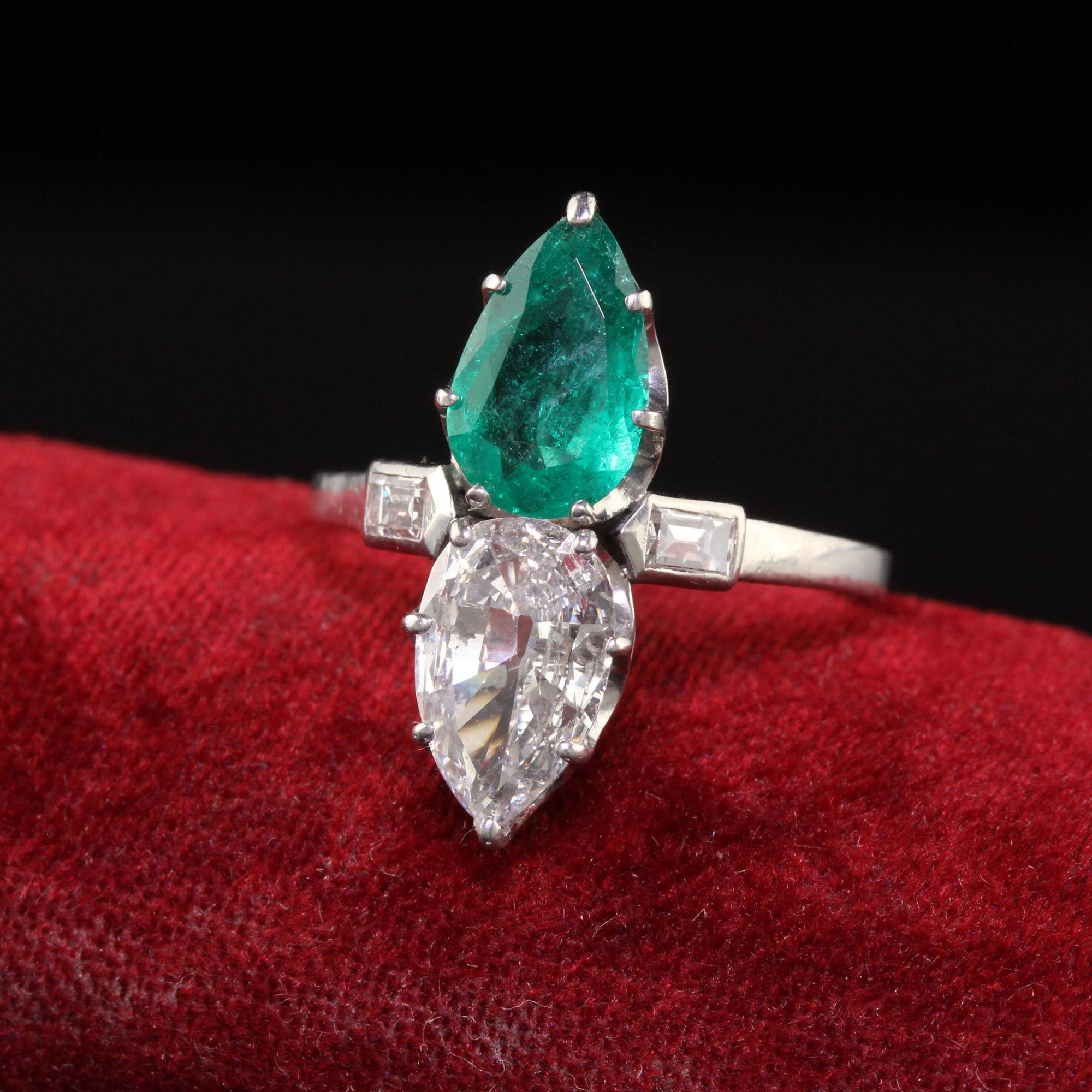 Beautiful Antique Art Deco Platinum French Pear Diamond Emerald Engagement Ring - GIA. This incredible engagement ring is crafted in platinum. The ring has an old pear shape diamond and emerald that have GIA reports. The gorgeous setting is French