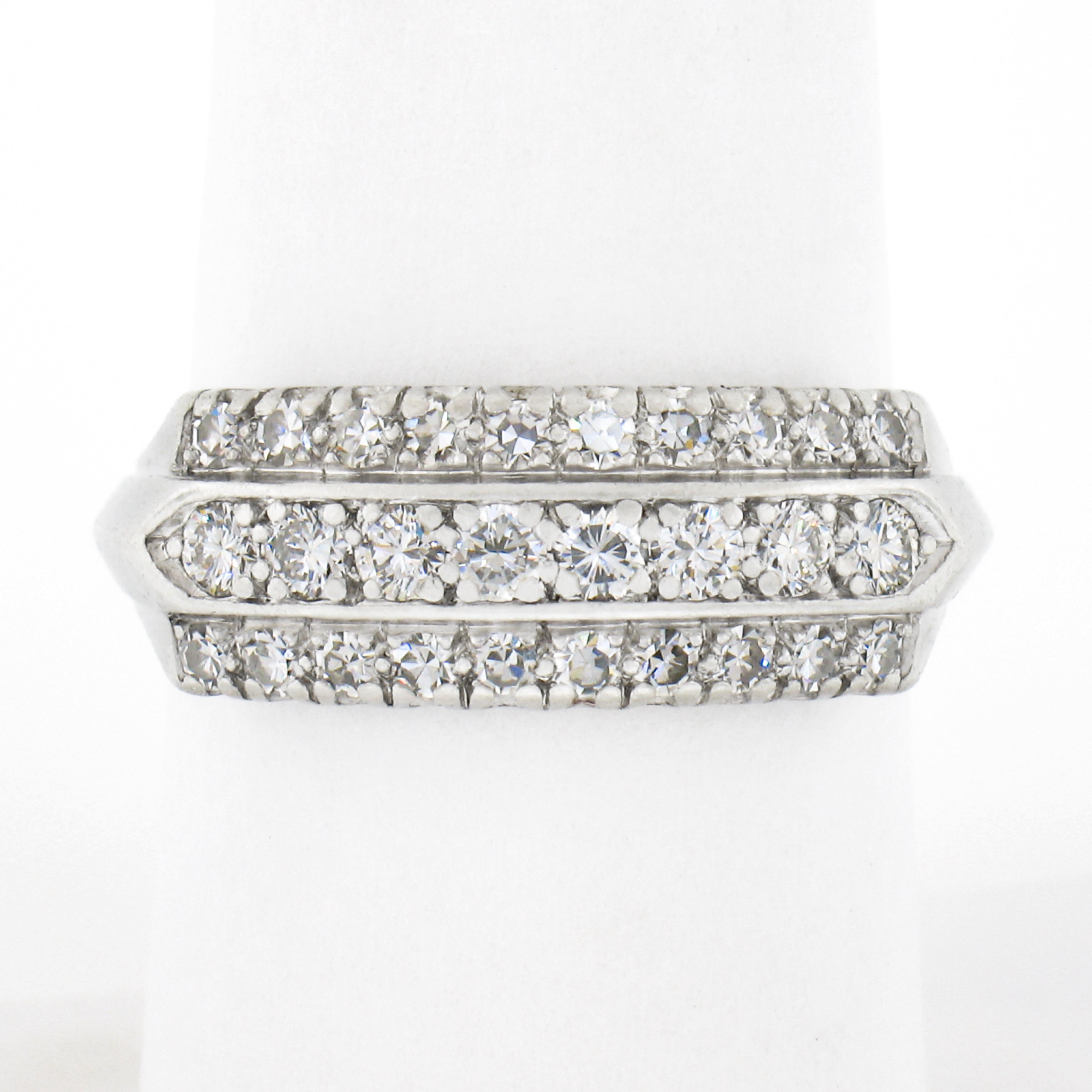 This gorgeous late art deco band ring is crafted in solid platinum and features 3 rows of stunning diamonds elegantly drenched throughout its top in neat fishtail prong settings. These fine diamonds total approximately 0.50 carat in weight and they