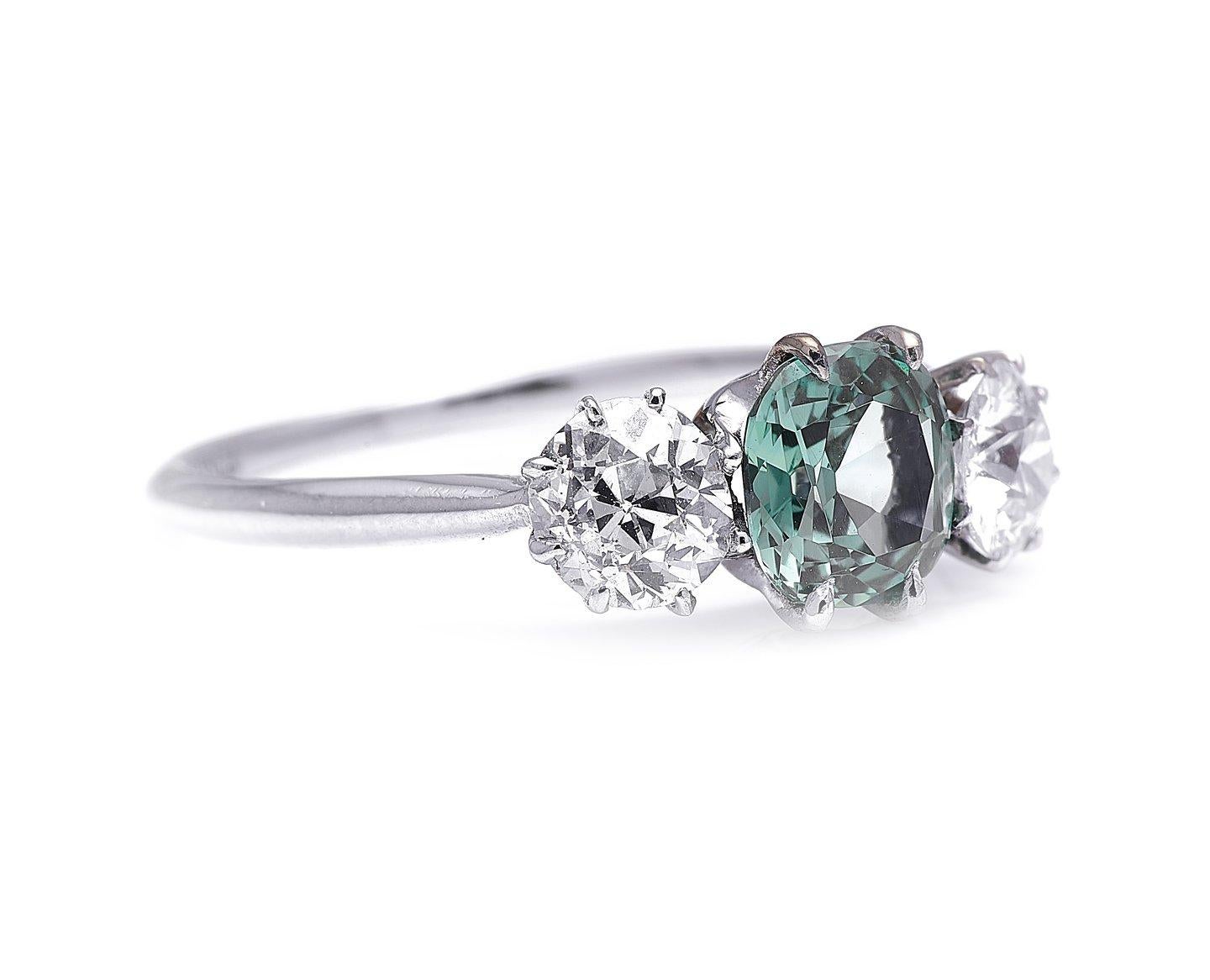 Green sapphire and diamond ring, circa 1925. In addition to their famous blue variety, sapphires come in a huge variety of different colours, depending on their chemical impurities. The sapphire at the centre of this ring is a silvery, sage green –
