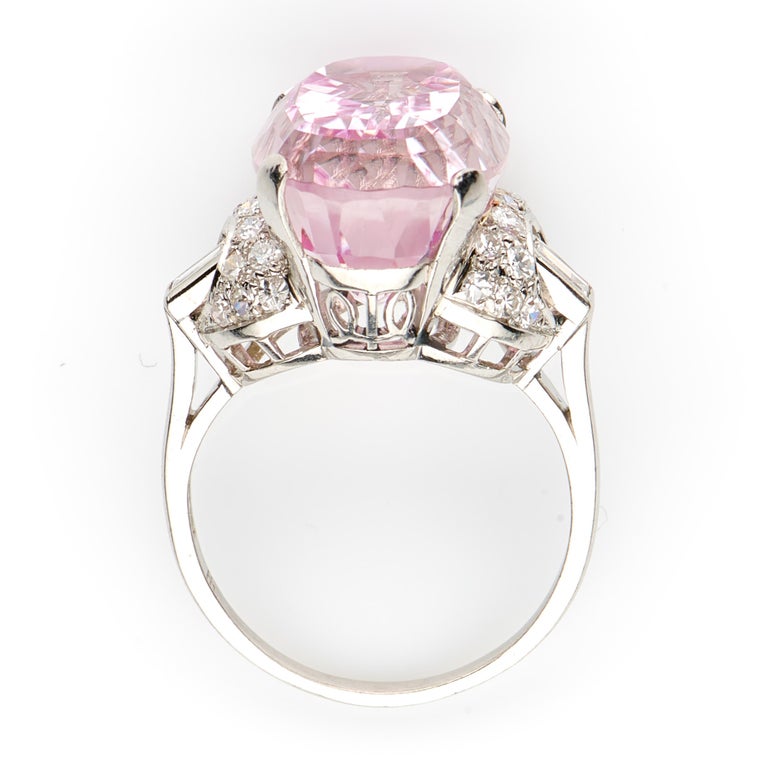 Art Deco, oval kunzite and diamond ring, circa 1925. A beautiful centre, soft pink, kunzite set in a simple four claw setting to enhance the impressive characteristics of the stone. The kunzite is flanked by curving raised diamond shoulders