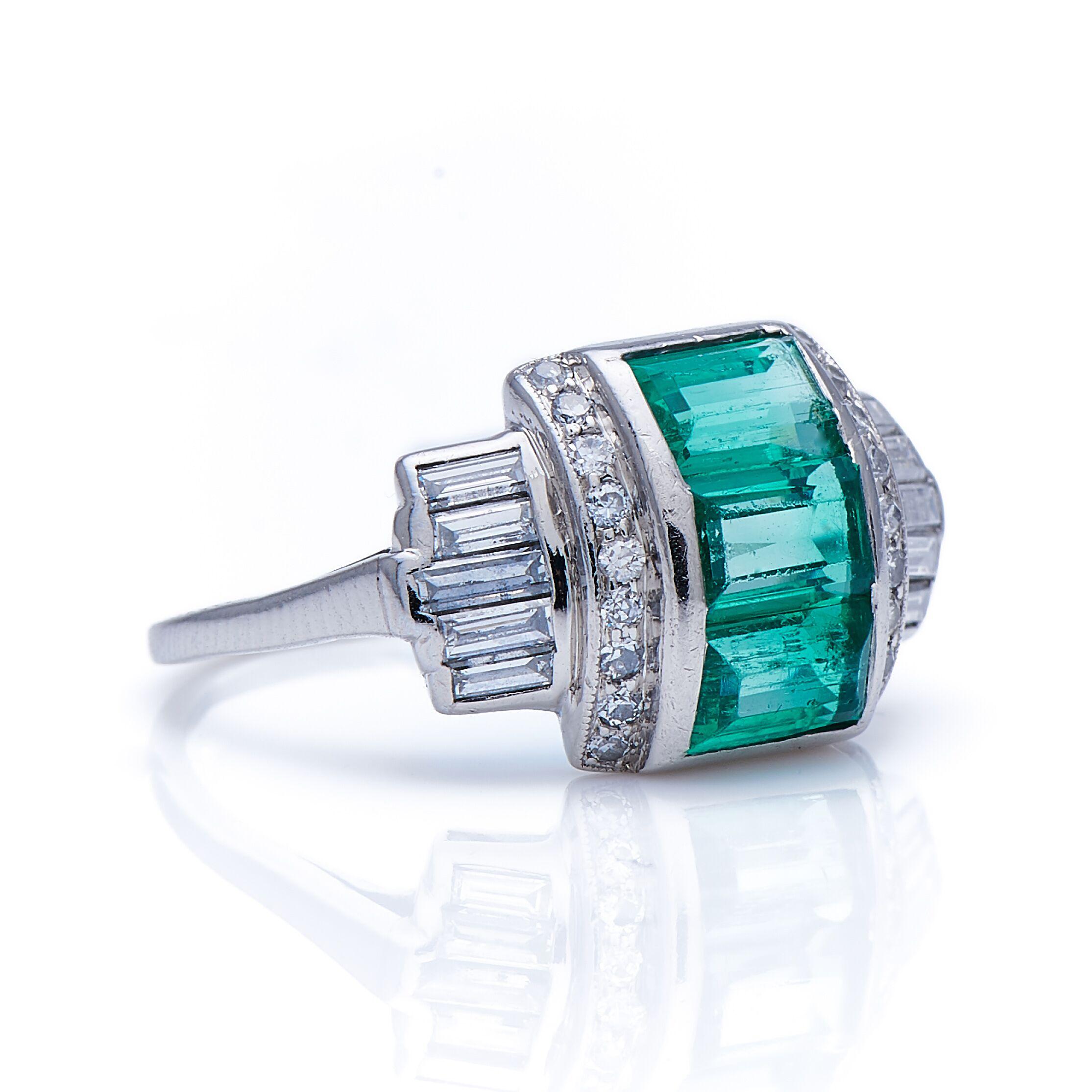 Emerald and diamond ring, circa 1930. This ring is a superb example of 1930s Art Deco, when jewels became more three dimensional and substantial, while retaining the pure geometry of the preceding decade. This domed ring is constructed from a