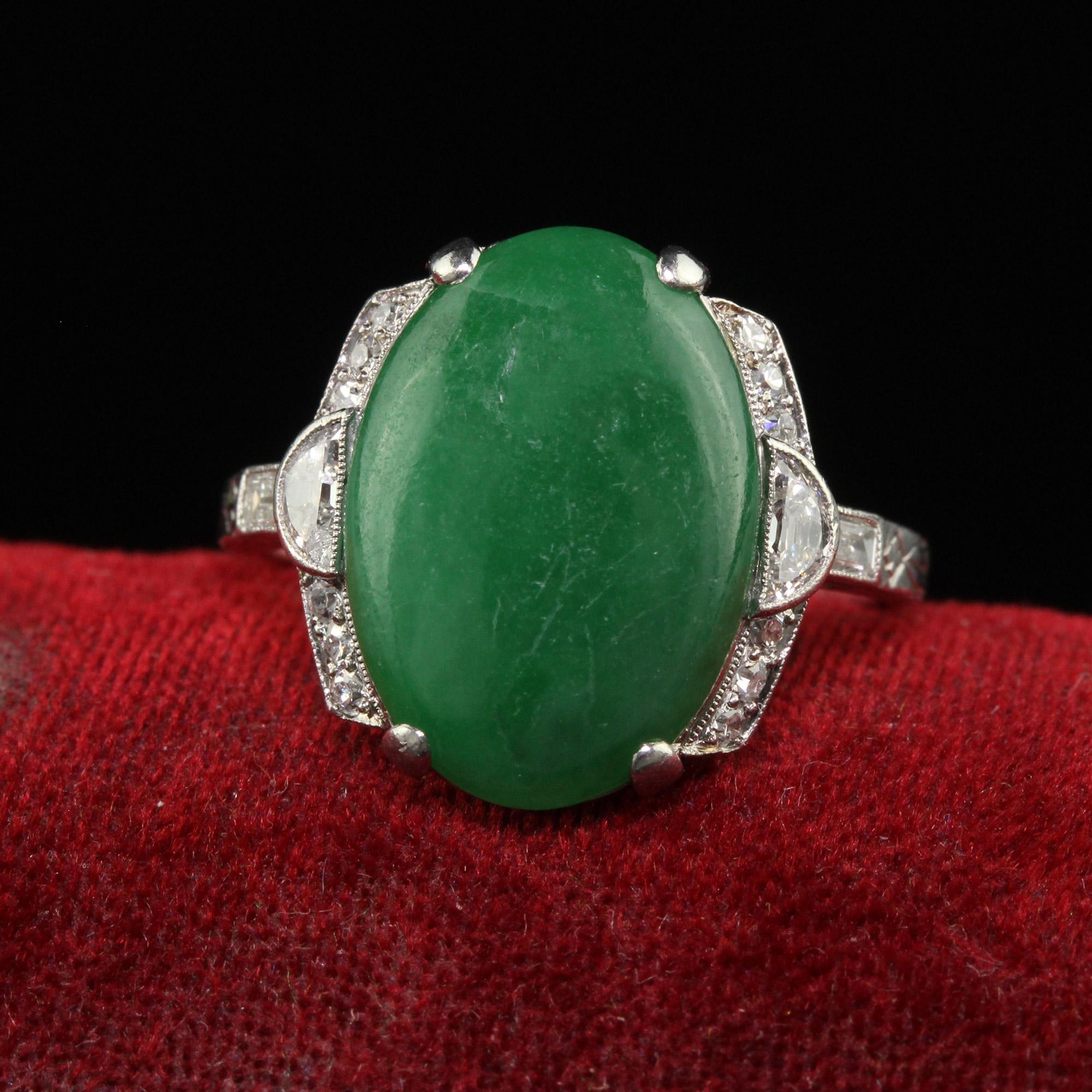 Beautiful Antique Art Deco Platinum Natural Fei Cui Jade and Diamond Cocktail Ring - GIA. This incredible Art Deco jade cocktail ring is crafted in platinum. This ring features a natural 