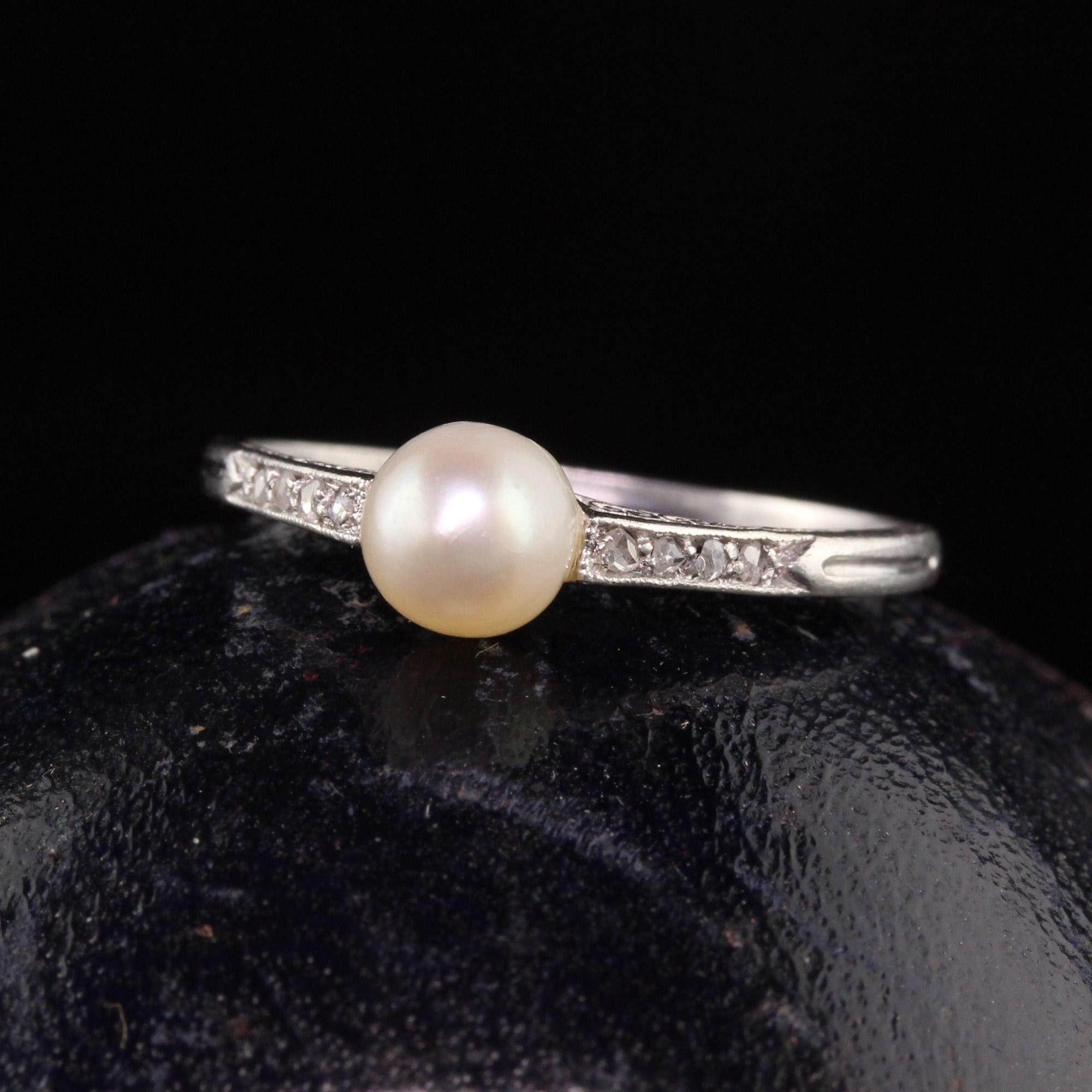 Beautiful Antique Art Deco Platinum Natural Pearl and Diamond Engagement Ring. This gorgeous Art Deco ring features a natural pearl center with rose cut diamonds on the sides. The sides of the ring are engraved as well beautifully.

Item