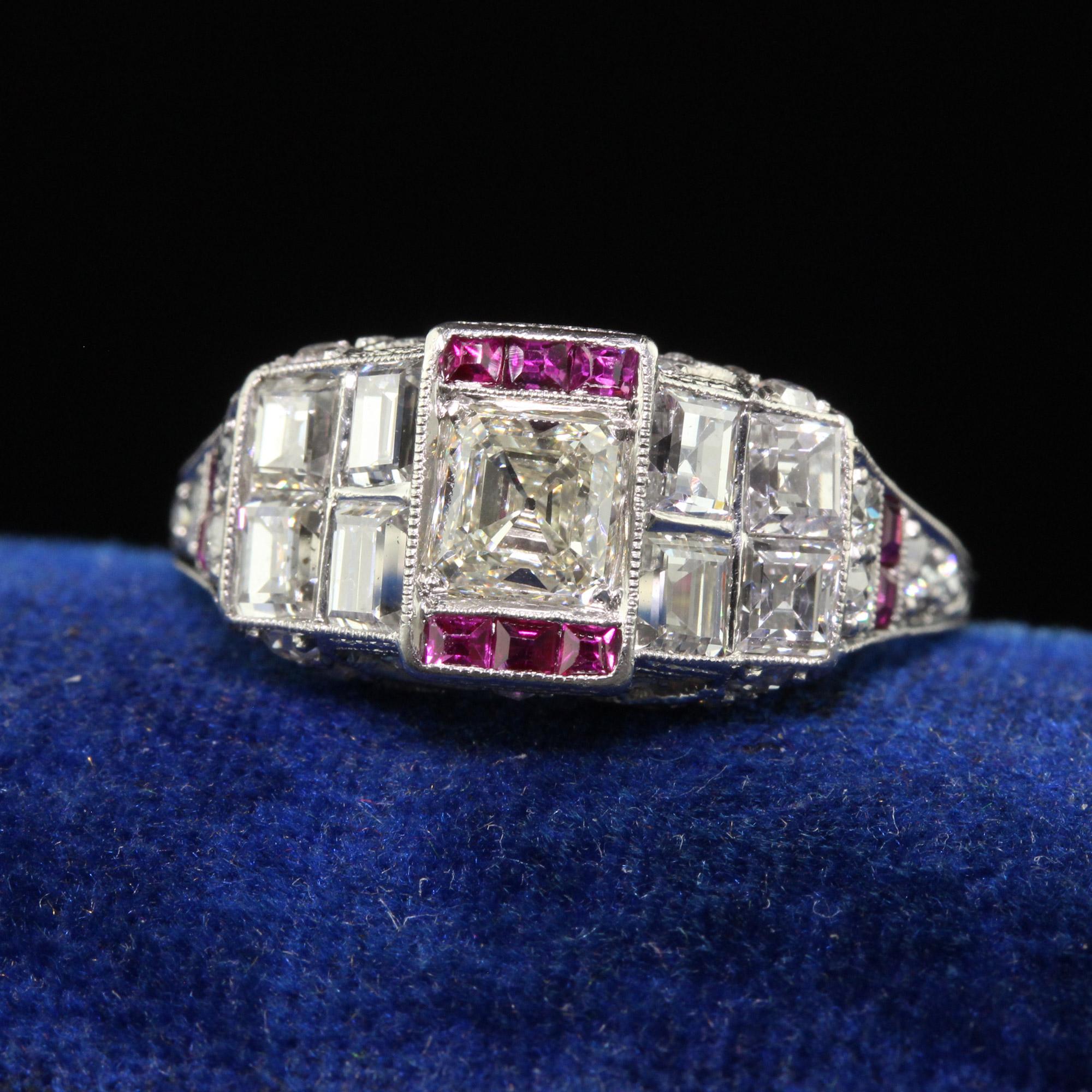 Beautiful Antique Art Deco Platinum Old Asscher Cut Diamond and Ruby Engagement Ring. This incredible Art Deco Asscher cut diamond engagement ring is crafted in platinum. This ring features an old Asscher cut diamond in the center and has old step