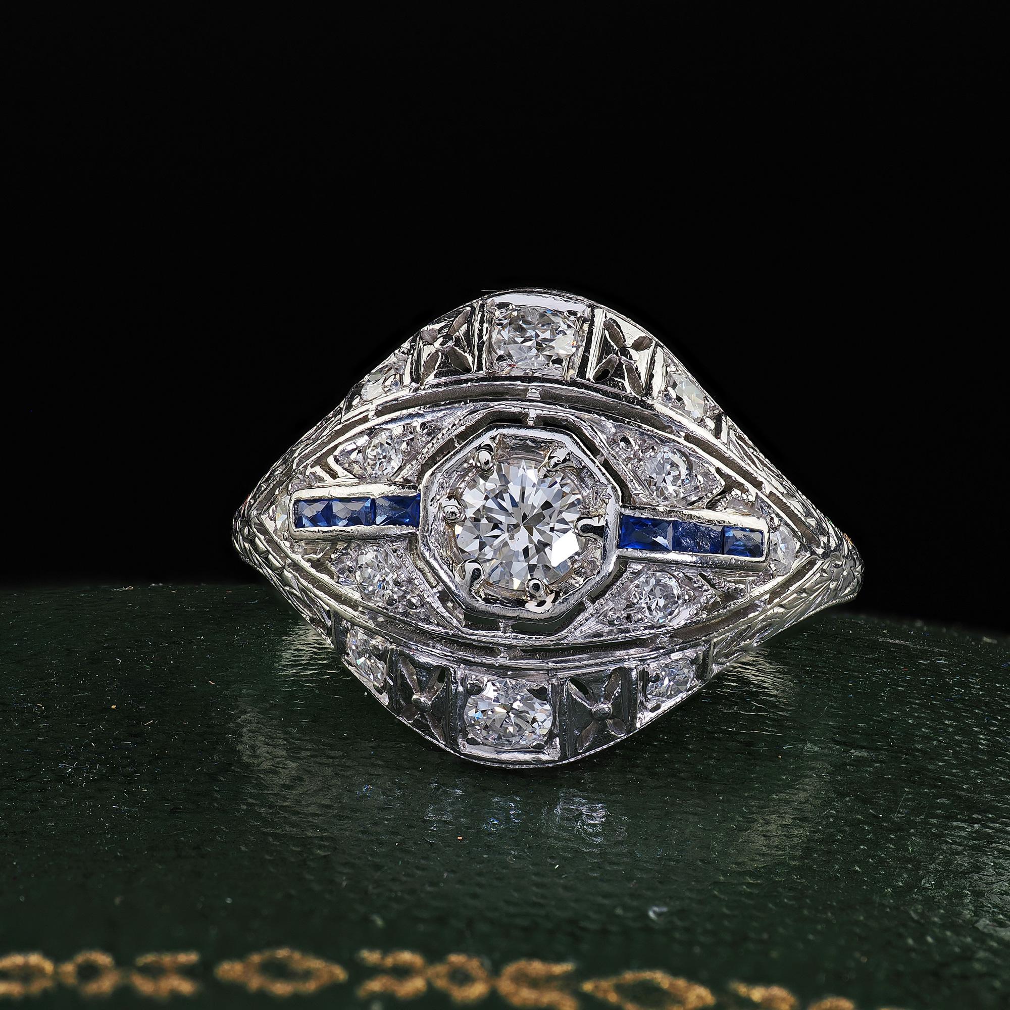 Beautiful Antique Art Deco Platinum Old Cut Diamond and Sapphire Engagement Ring. This beautiful Art Deco old cut diamond and sapphire engagement ring is crafted in platinum. The ring features a beautiful old cut diamond in the center and is