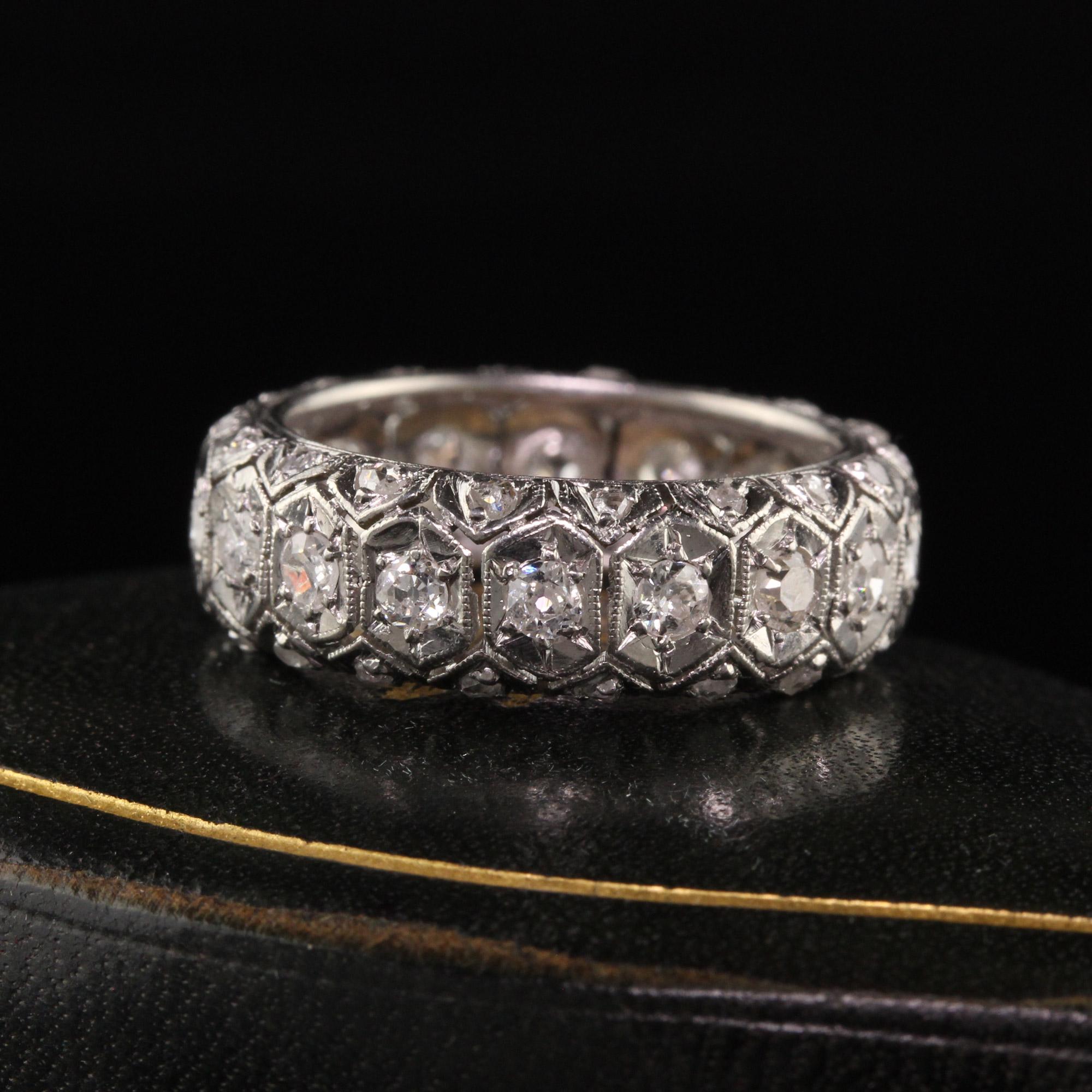 Beautiful Antique Art Deco Platinum Old Euro and Rose Cut Three Row Eternity Band. This incredible band is crafted in platinum. The band has old cut diamonds in the center with rose cut diamonds on the two outside rows. They are set in a gorgeous