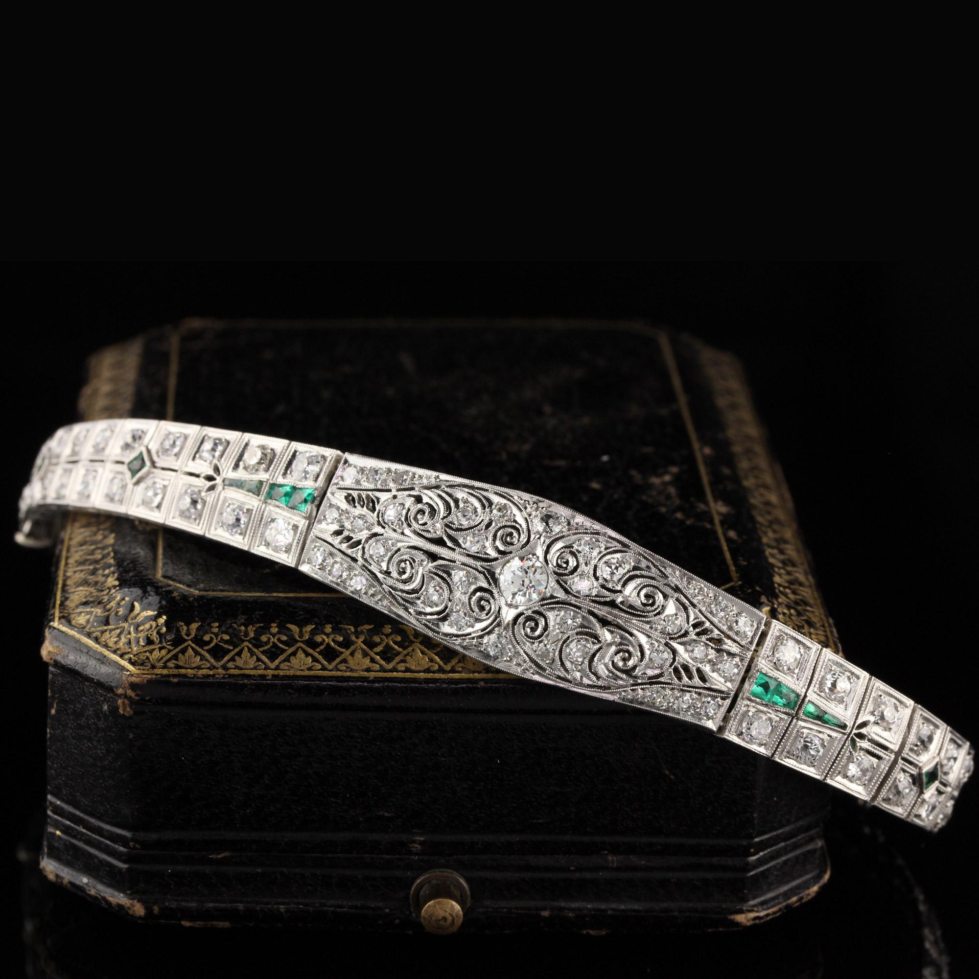 Stunning antique platinum bracelet with old european cut diamonds and emeralds. 

Item #B0024

Metal: Platinum

Weight: 29.3 Grams

Total Diamond Weight: Approximately 5.50 cts

Diamond Color: H

Diamond Clarity: VS2 - SI1

Measurements: 7 in x 5.5