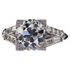 Anello di fidanzamento antico Art Deco in platino con diamante e baguette - GIA