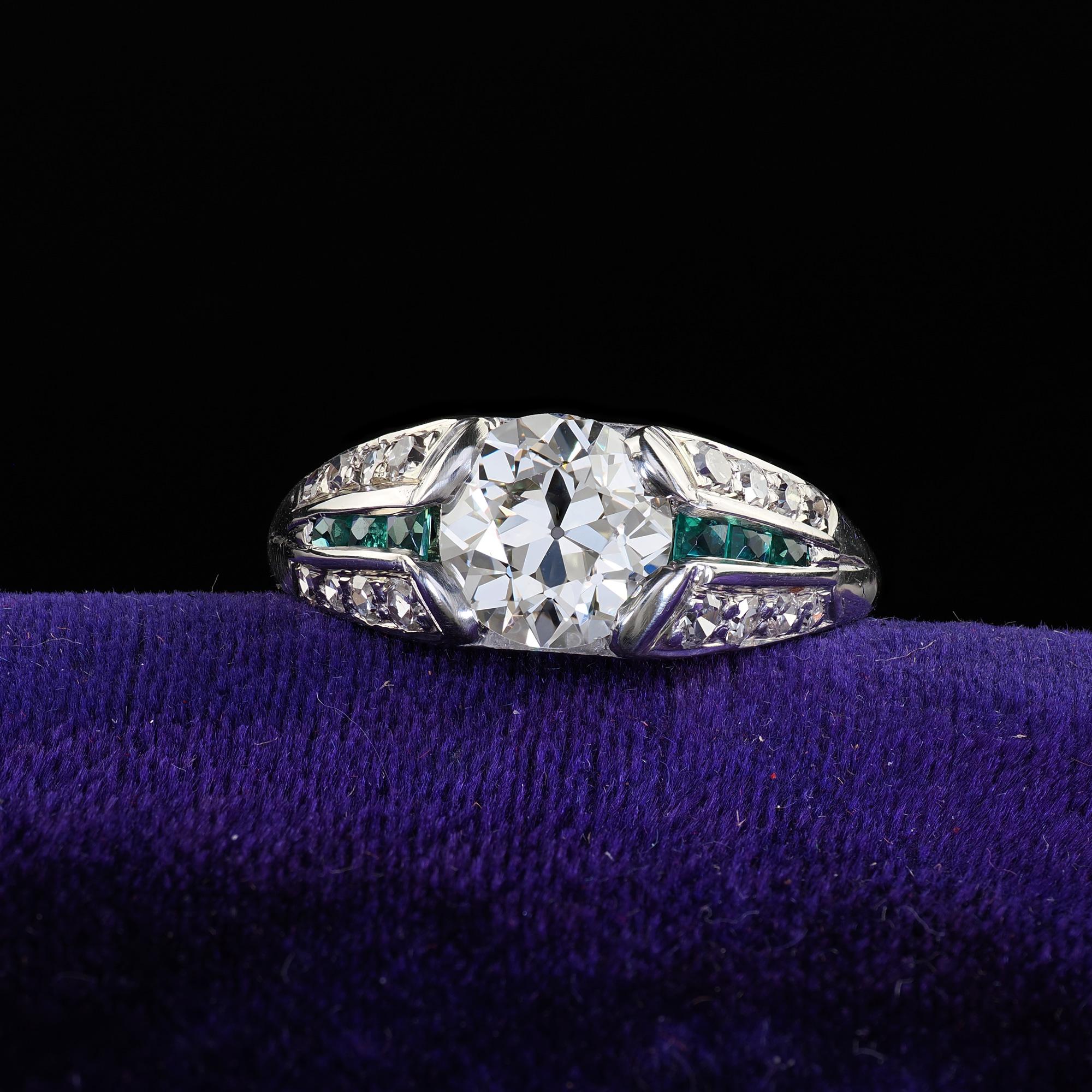 Beautiful Antique Art Deco Platinum Old Euro Diamond and Emerald Engagement Ring - GIA. This gorgeous antique Art Deco old Euro diamond and emerald engagement ring is crafted in platinum. This gorgeous ring features an old European cut diamond in