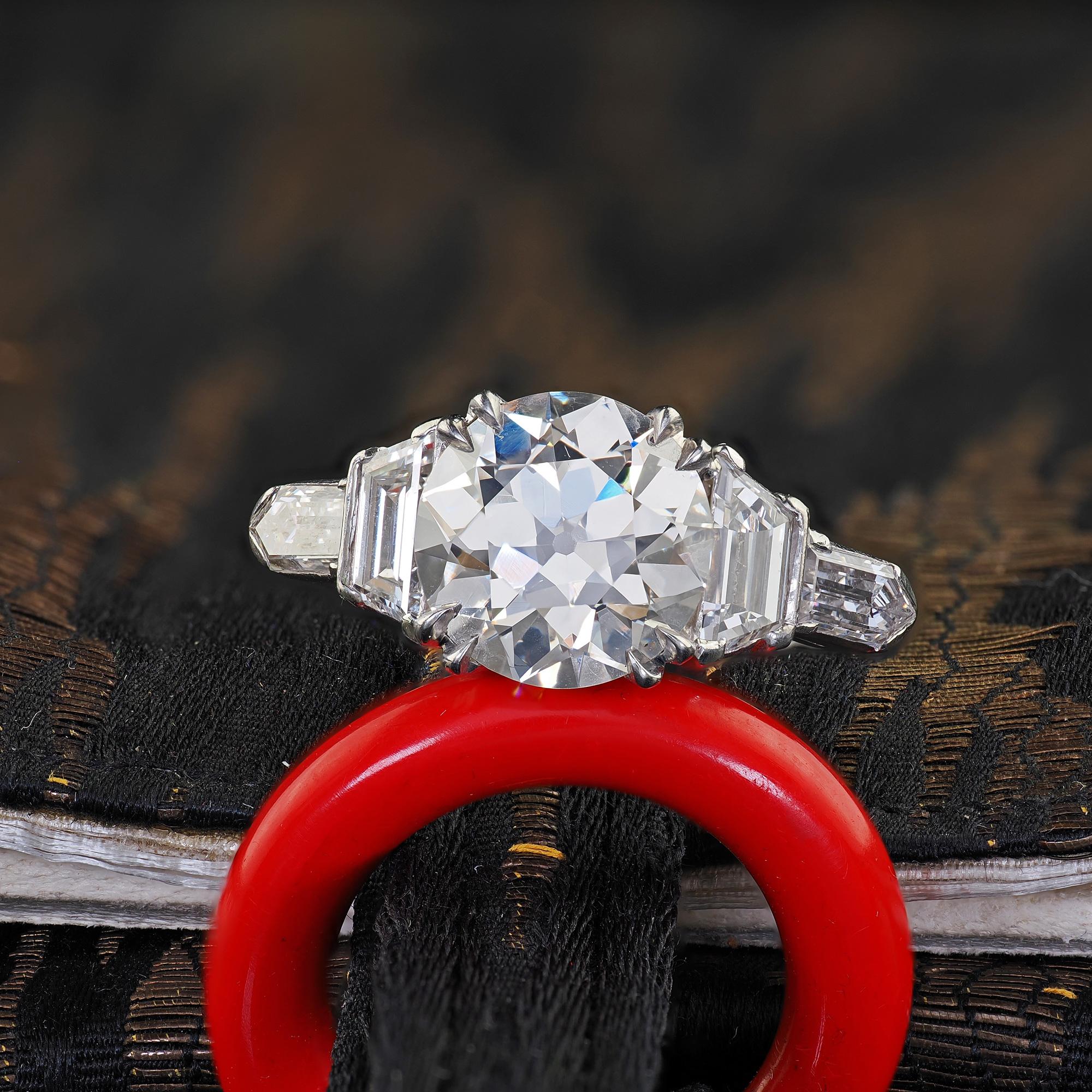 Beautiful Antique Art Deco Platinum Old Euro Diamond Bullet Cut Engagement Ring - GIA. This incredible Art Deco old European and bullet cut diamond engagement ring is crafted in platinum. This gorgeous ring holds a bright old European cut diamond in