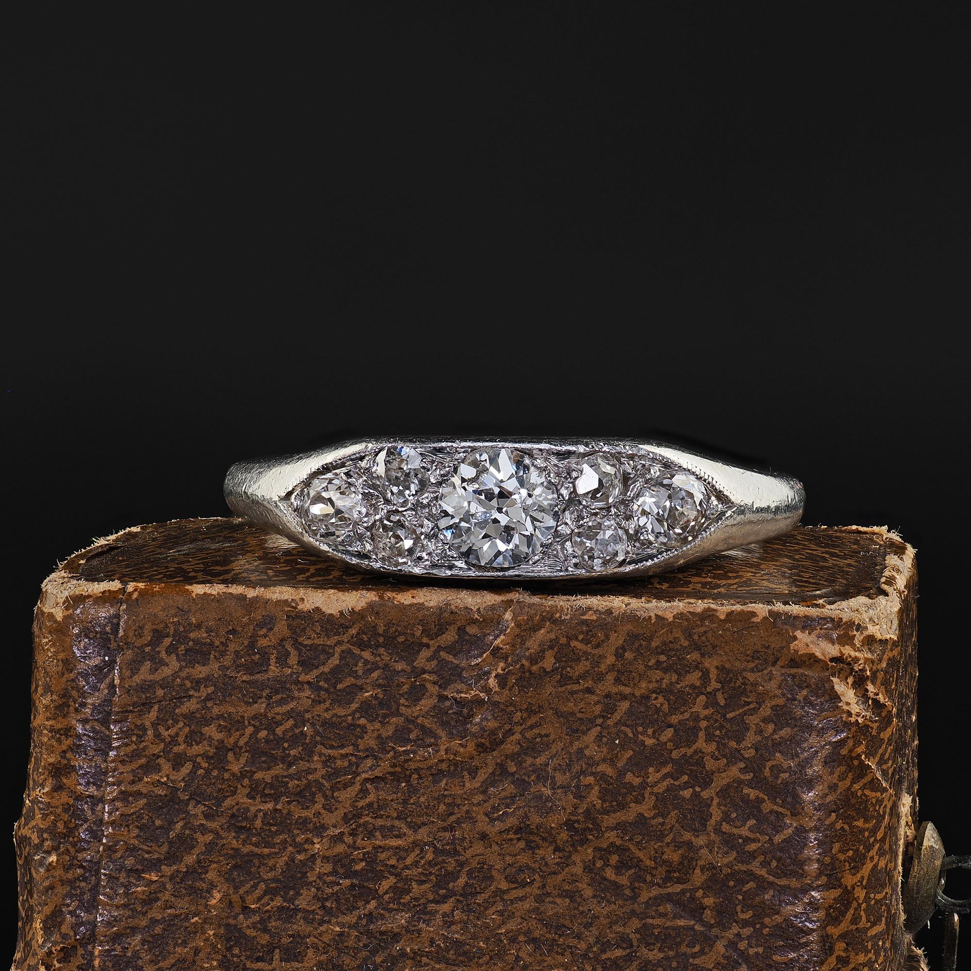 Beautiful Antique Art Deco Platinum Old Euro Diamond Cluster Band - Size 8. This gorgeous Art Deco old Euro diamond band is crafted in platinum. The ring features old cut diamonds set in a beautiful cluster pattern on top. The ring tapers down to a