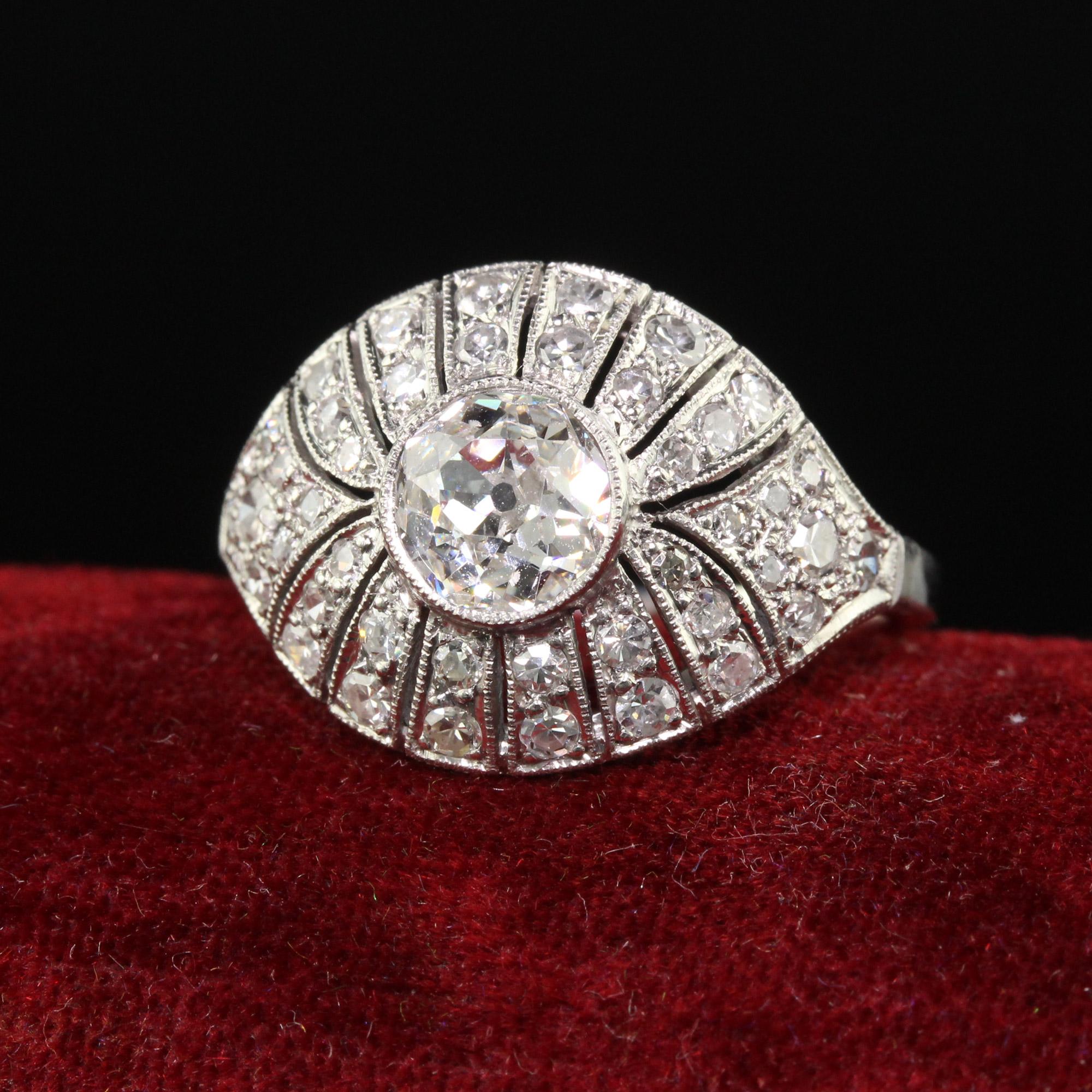 Beautiful Antique Art Deco Platinum Old Euro Diamond Filigree Engagement Ring. This beautiful shield ring is crafted in platinum. The center holds a chunky old European cut diamond that is set in a gorgeous art deco mounting that has single cut
