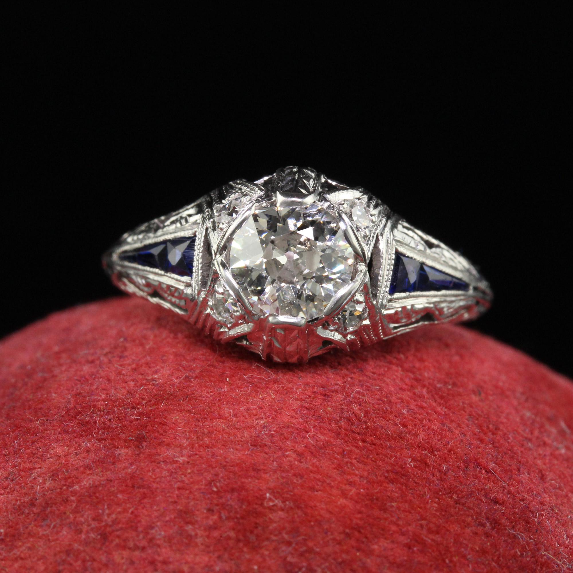 Beautiful Antique Art Deco Platinum Old Euro Diamond Sapphire Engagement Ring. This gorgeous art deco engagement ring is crafted in platinum. The center holds a beautiful old European cut diamond and is set in a gorgeous art deco mounting that has