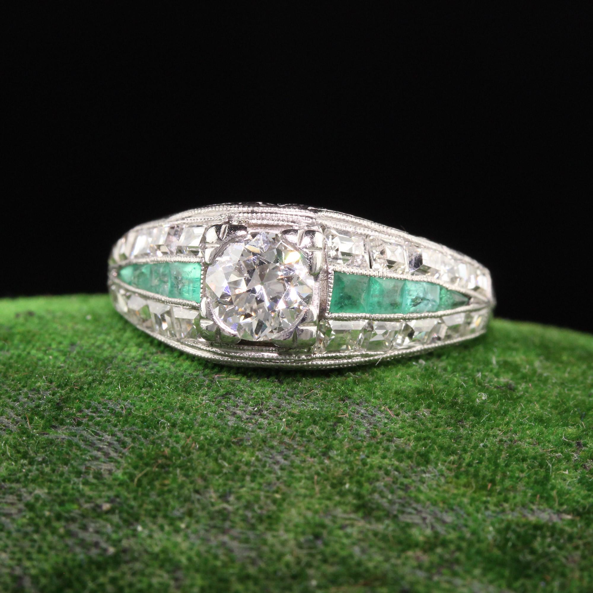 Beautiful Antique Art Deco Platinum Old European and Carre Cut Diamond Engagement Ring. This incredible ring features an old european diamond in the center with carre cut diamonds on the sides with emeralds in between them. The emeralds have