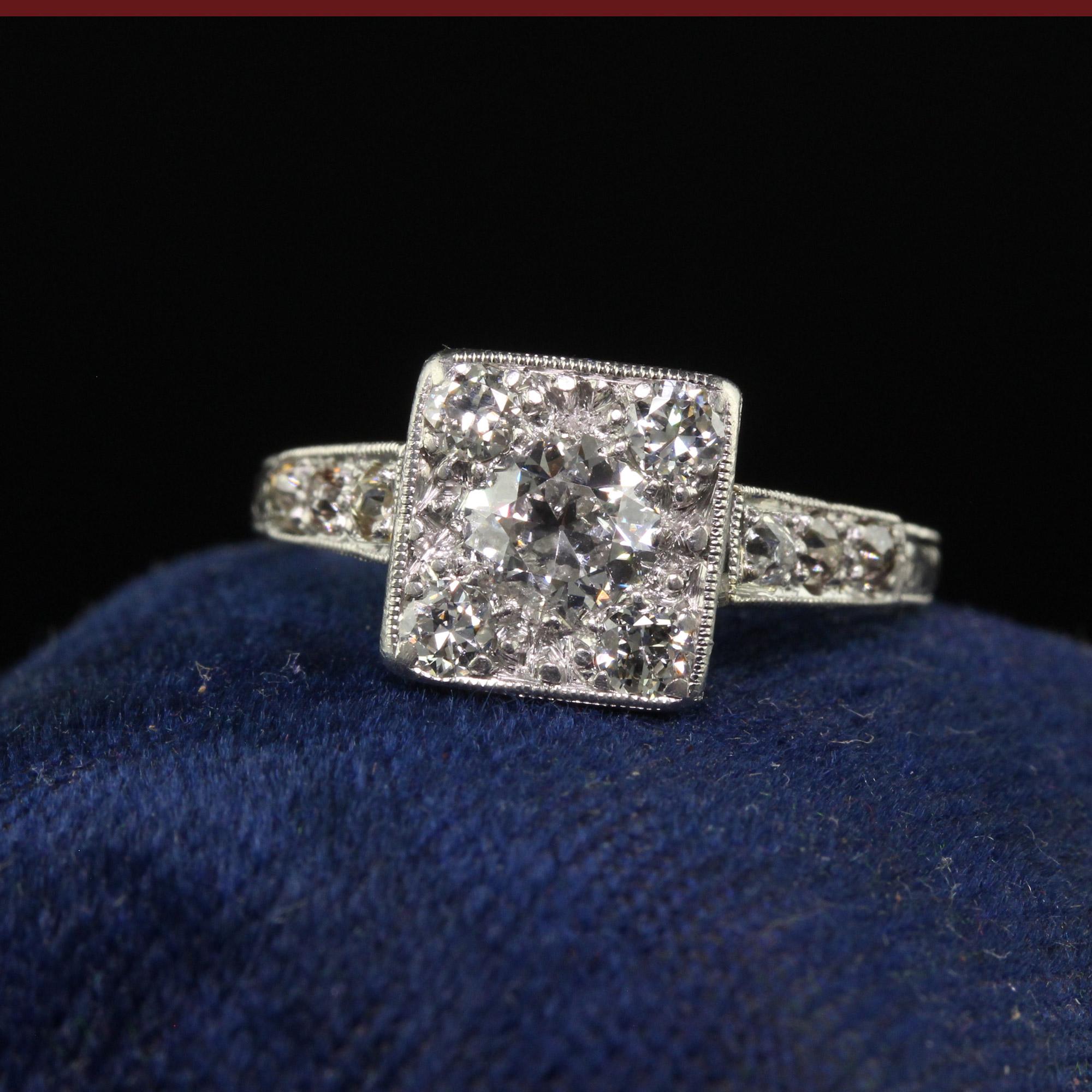 Beautiful Antique Art Deco Platinum Old European Cut Diamond Cluster Engagement Ring. This incredible engagement ring is crafted in platinum. The center holds an old European cut diamond that has four old cut diamonds on each corner of the stone. Th