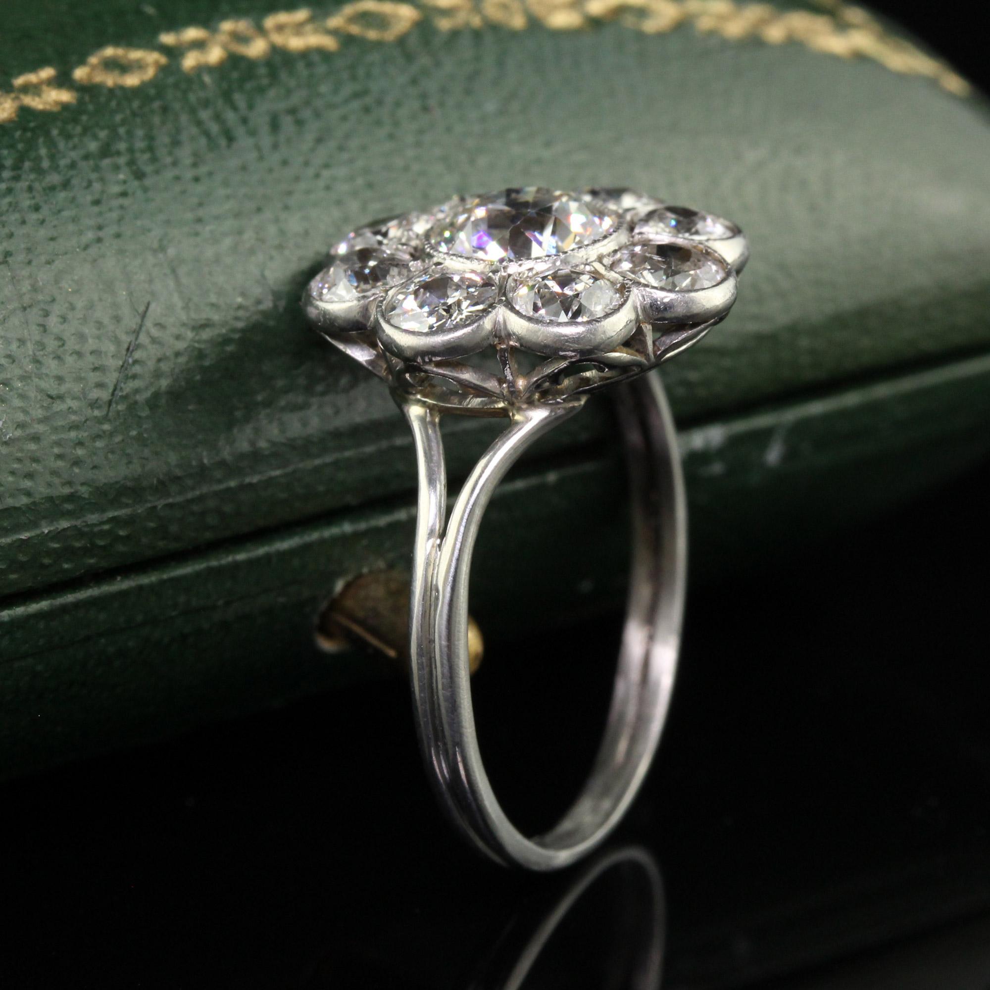 Antique Art Deco Platinum Old European Cut Diamond Cluster Engagement Ring In Good Condition For Sale In Great Neck, NY