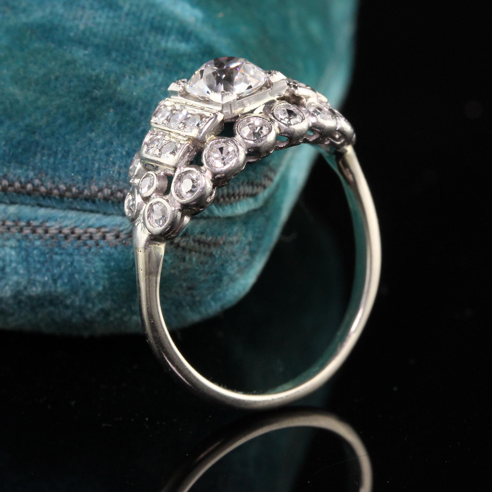 Beautiful Antique Art Deco Platinum Old European Cut Diamond Engagement Ring. This striking engagement ring has an old european cut diamond in the center surrounded by many single cut diamonds.

Item #R0913

Metal: Platinum and 14K White Gold