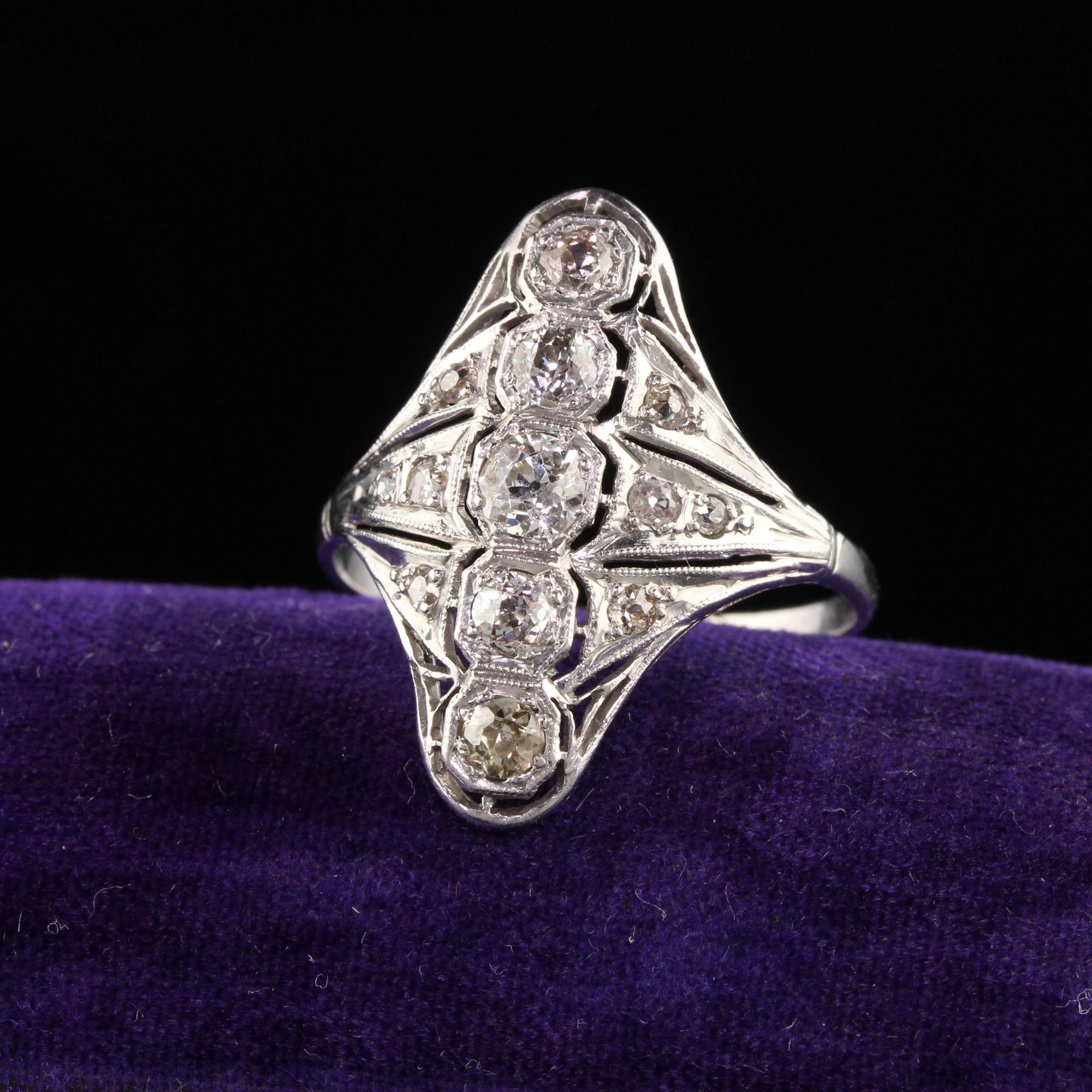 Beautiful Antique Art Deco Platinum Old European Cut Diamond Filigree Shield Ring. This beautiful shield ring is crafted in platinim. The ring has old mine and old european cut diamonds on a filigree mounting with milgraining.

Item #R1304

Metal: