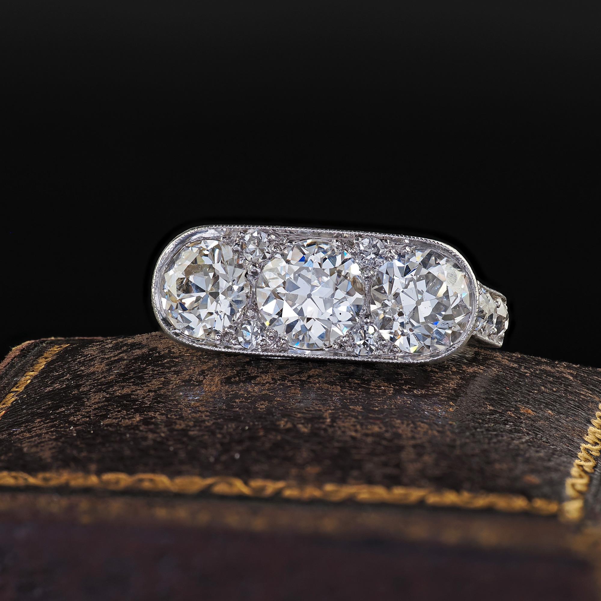 Beautiful Antique Art Deco Platinum Old European Cut Diamond Three Stone Diamond Ring. This incredible Art Deco old European diamond three stone ring is crafted in platinum. This amazing ring features three large old European cut diamonds set on top