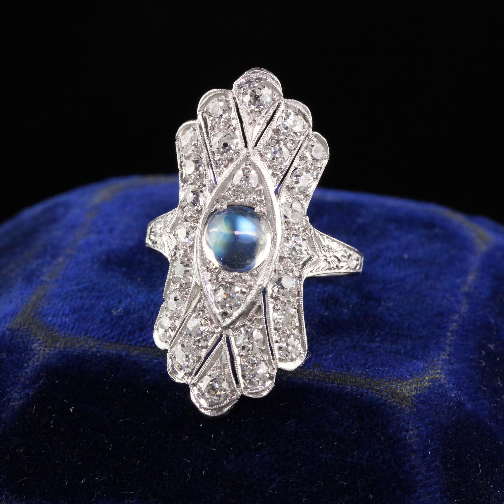 Beautiful Antique Art Deco Platinum Old European Diamond and Moonstone Shield Ring. This incredible shield ring has old european cut diamonds all over it in a gorgeous design with a bright moonstone in the center.

Item #R1006

Metal: