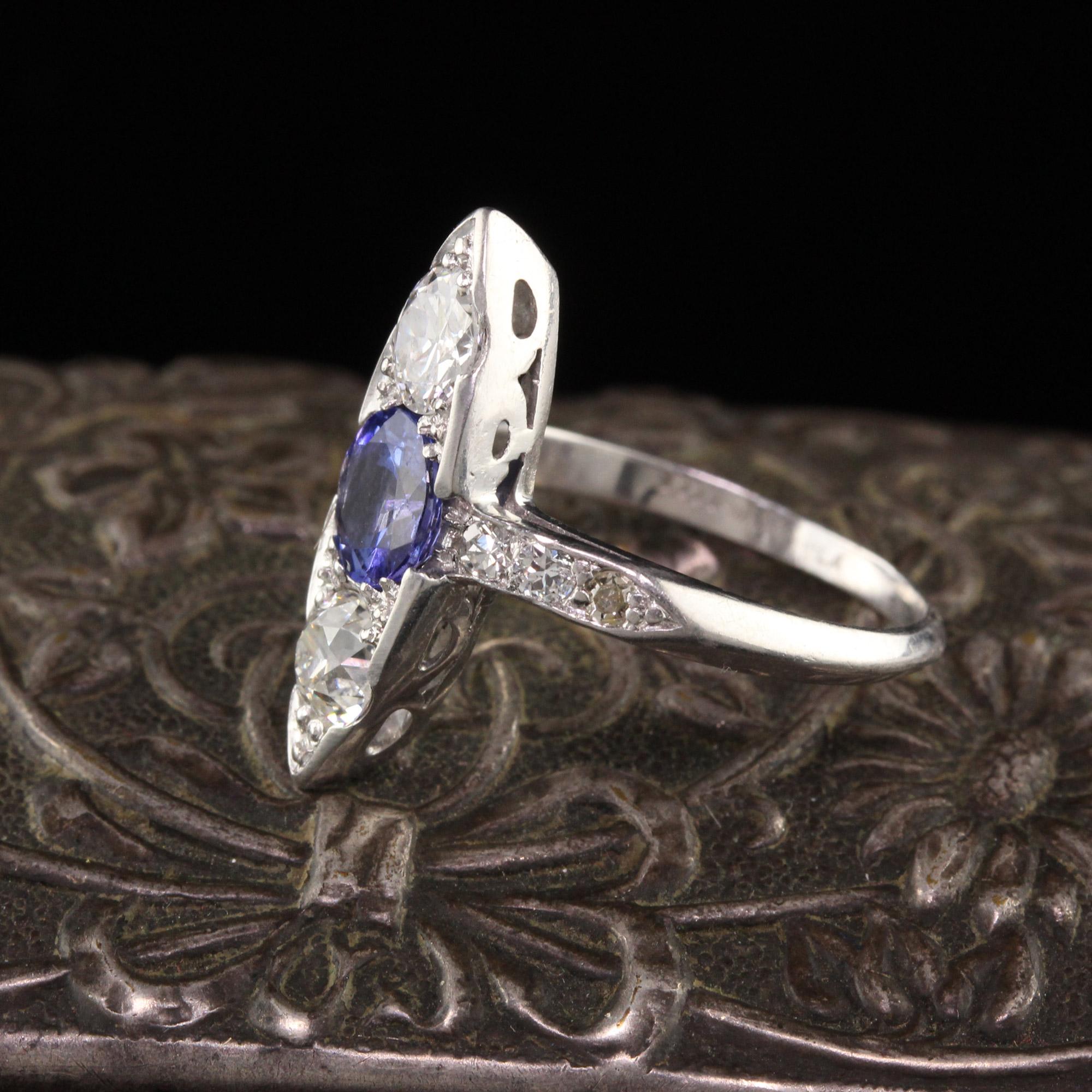 Beautiful Antique Art Deco Platinum Old European Diamond and Sapphire Three Stone Ring. This gorgeous three stone ring features two old european cut diamonds and a bright purple sapphire in the center of a platinum mounting.

Item #R0828

Metal: