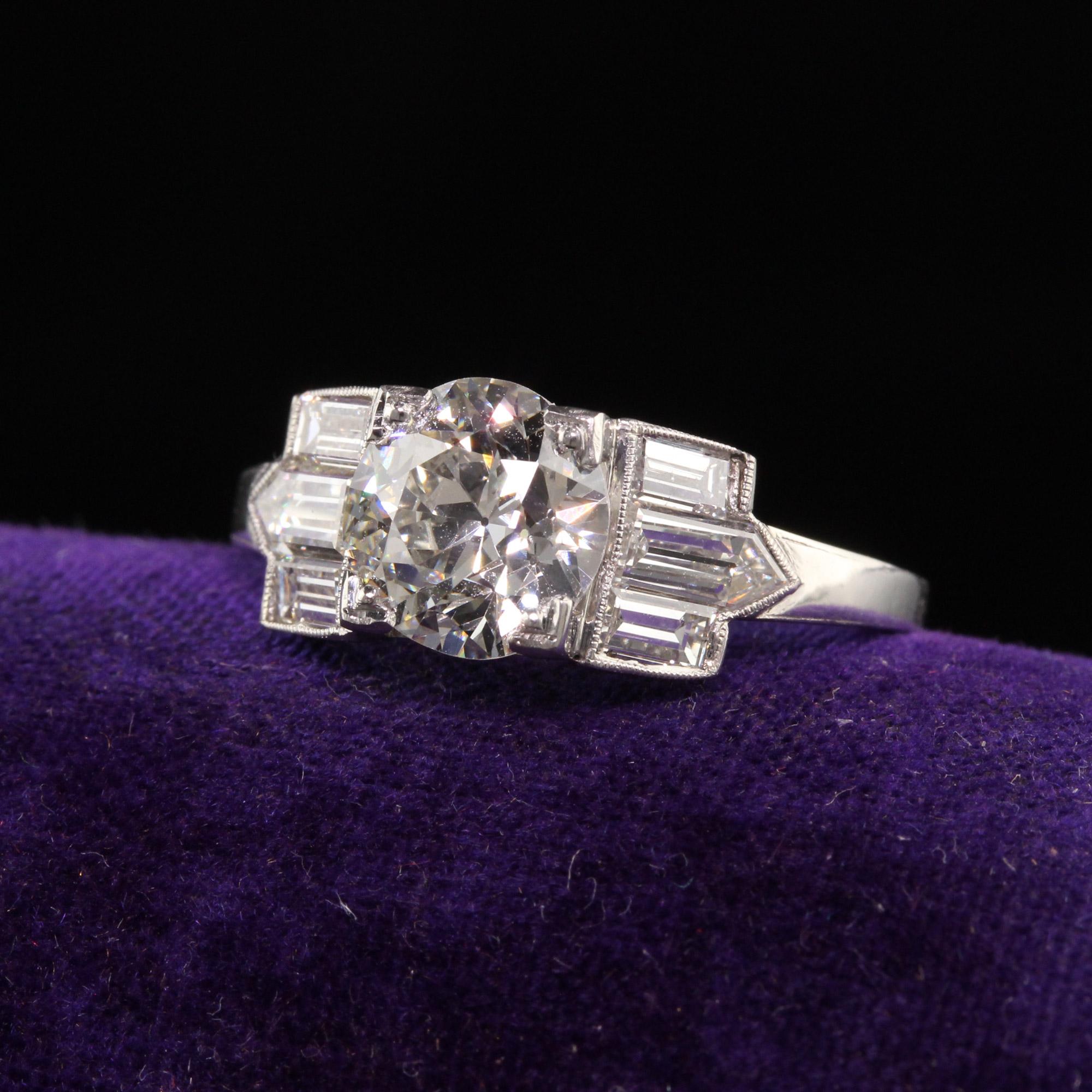 Beautiful Antique Art Deco Platinum Old European Diamond Baguette Engagement Ring - GIA. This incredible engagement ring is crafted in platinum. The center holds a beautiful old european cut stone and is set in a gorgeous Art Deco mounting with