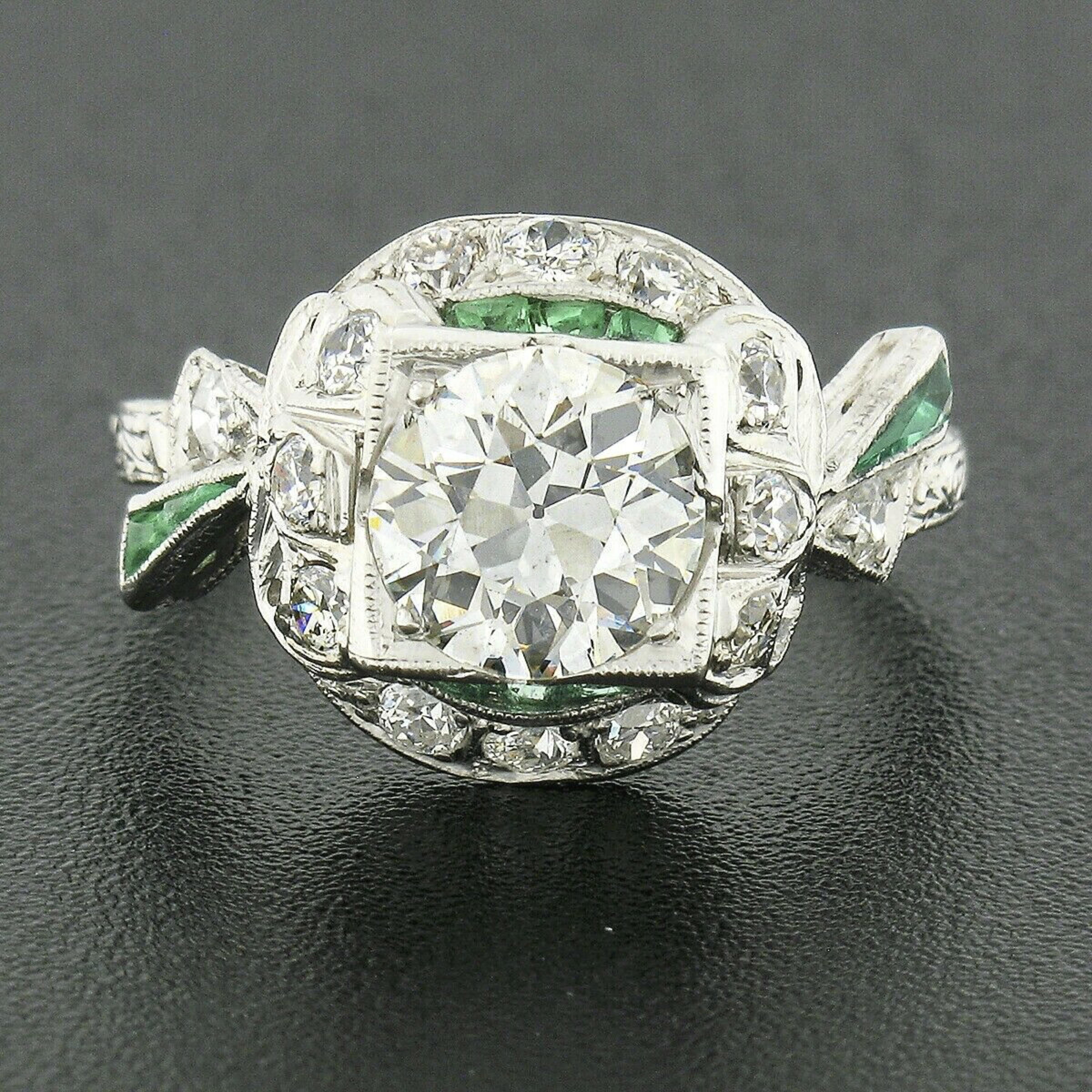 This truly breathtaking antique diamond engagement ring was crafted in solid platinum during the early art deco period. This ring features a large old European cut diamond that's neatly prong set at the center of a square shaped basket weighing