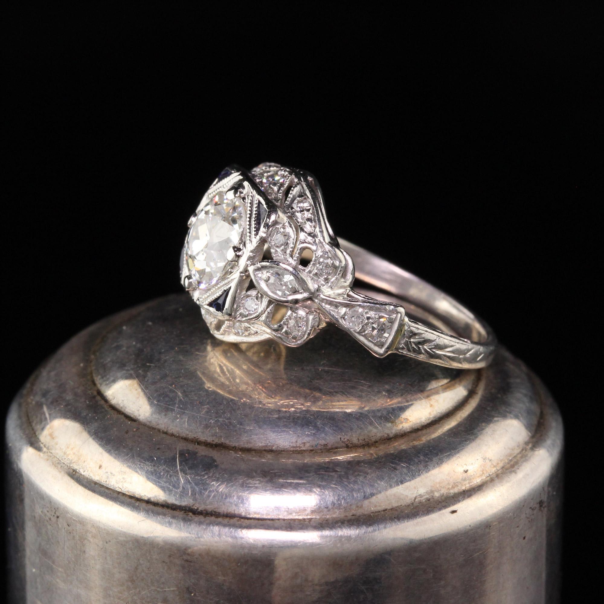Gorgeous Antique Art Deco Platinum Old European Diamond Engagement Ring. This gorgeous engagement ring is in wonderful condition with a 1.06 ct old european cut diamond with sapphire accents. It is a bright showstopper! 

Item #R0686

Metal: