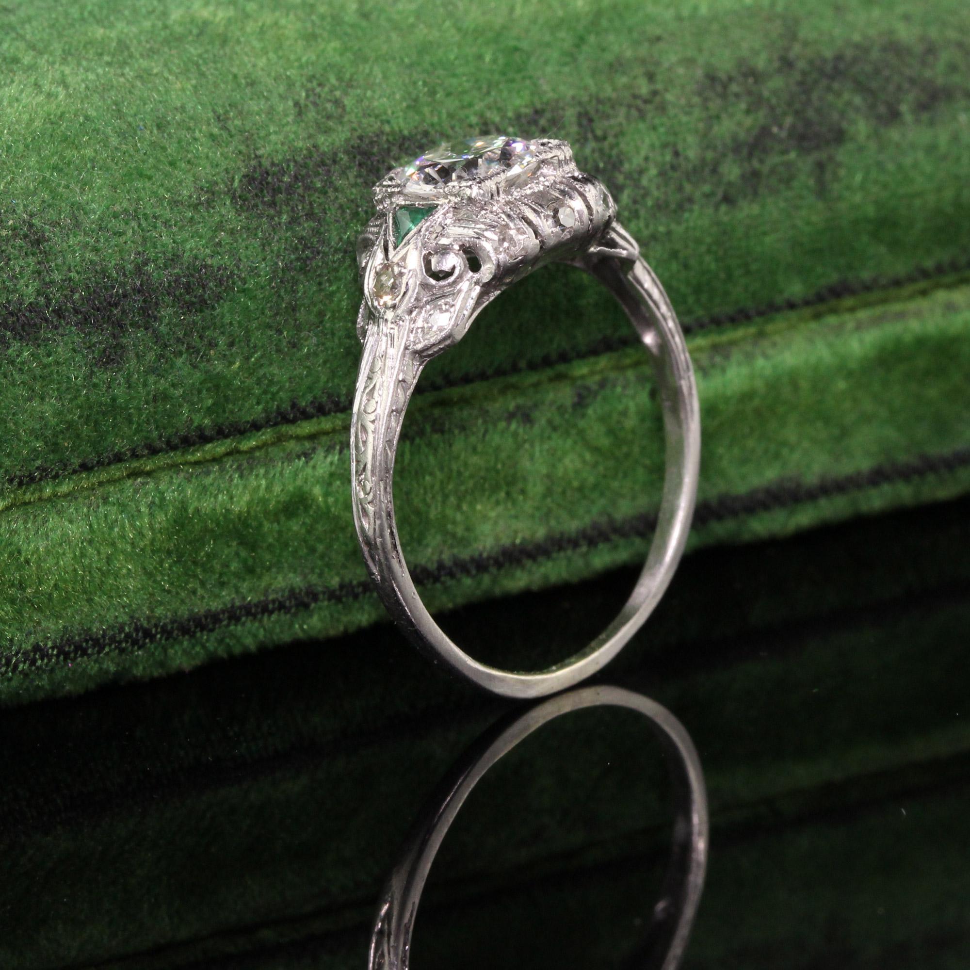 Beautiful Antique Art Deco Platinum Old European Diamond Engagement Ring. This gorgeous art deco engagement ring has a very bright and white old european cut diamond in the center of a stunning platinum mounting with emerald accents.

Item