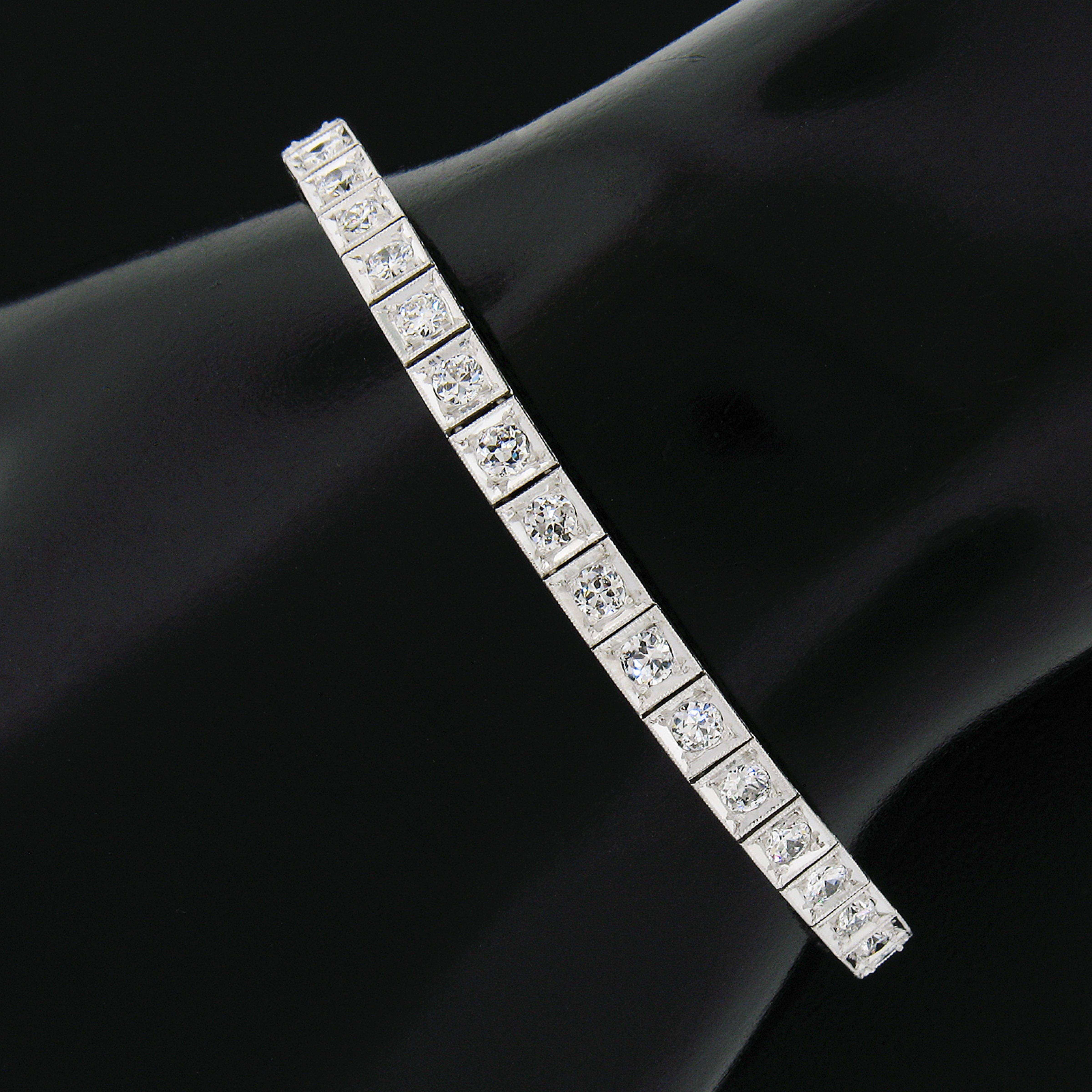 Here we have a magnificent classic antique art deco diamond tennis bracelet. This bracelet is crafted in solid platinum and features 40 old European cut diamonds neatly set in square prong settings and decorated with fine Milgrain etching technique