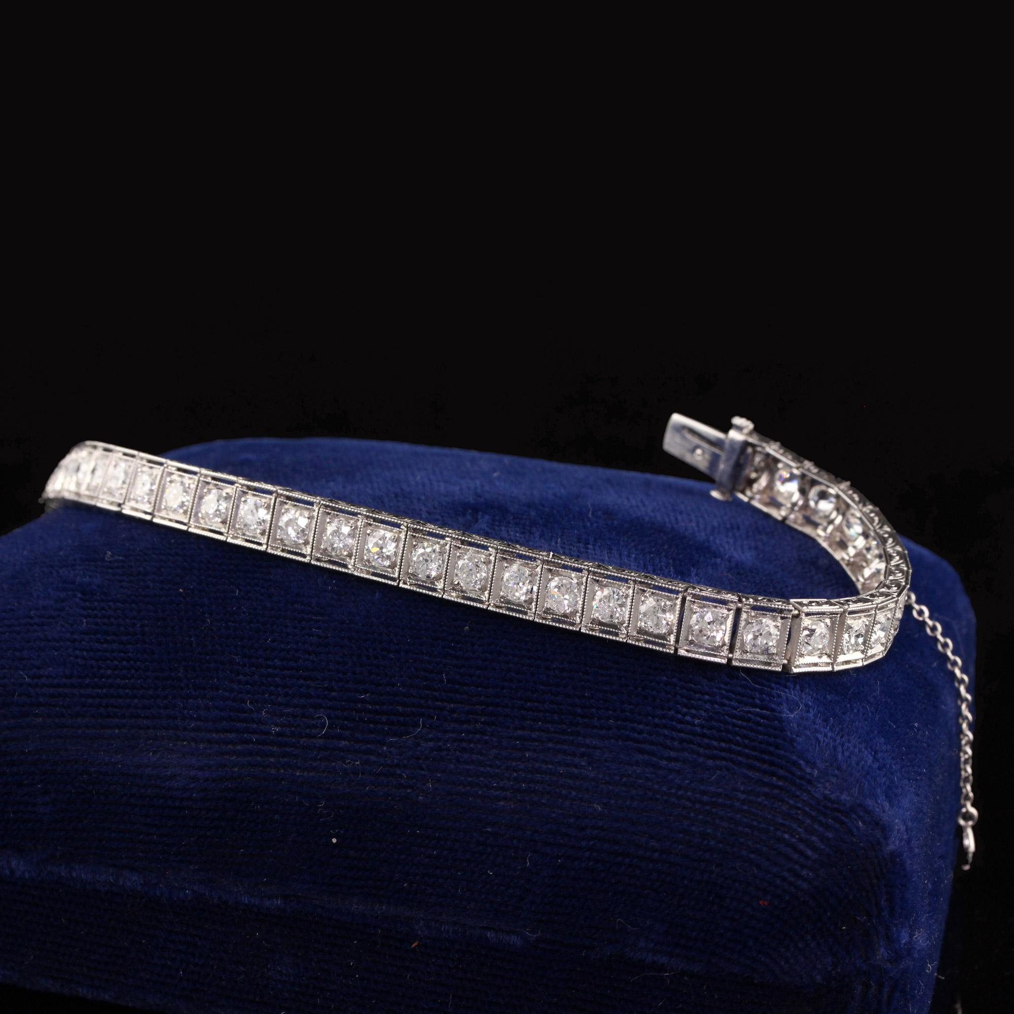 Beautiful Antique Art Deco Platinum Old European Diamond Engraved Tennis Bracelet. This incredible bracelet is crafted in platinum. There are old european diamonds going across the bracelet and it is in great condition. The engravings and milgrain