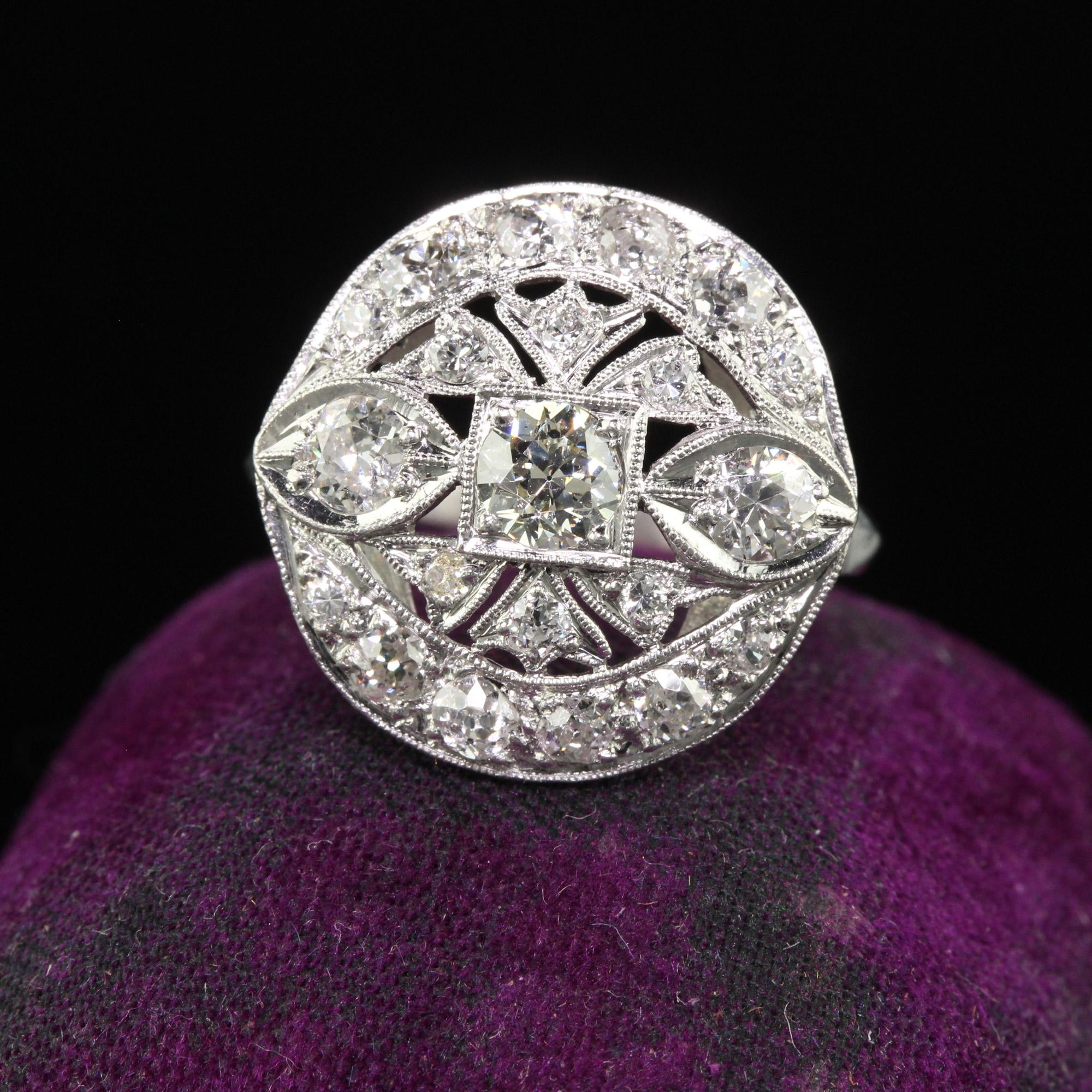 Beautiful Antique Art Deco Platinum Old European Diamond Filigree Cocktail Ring. This gorgeous Art Deco cocktail ring is crafted in platinum. The center holds a beautiful old European cut diamond and has chunky old European cut diamonds through the