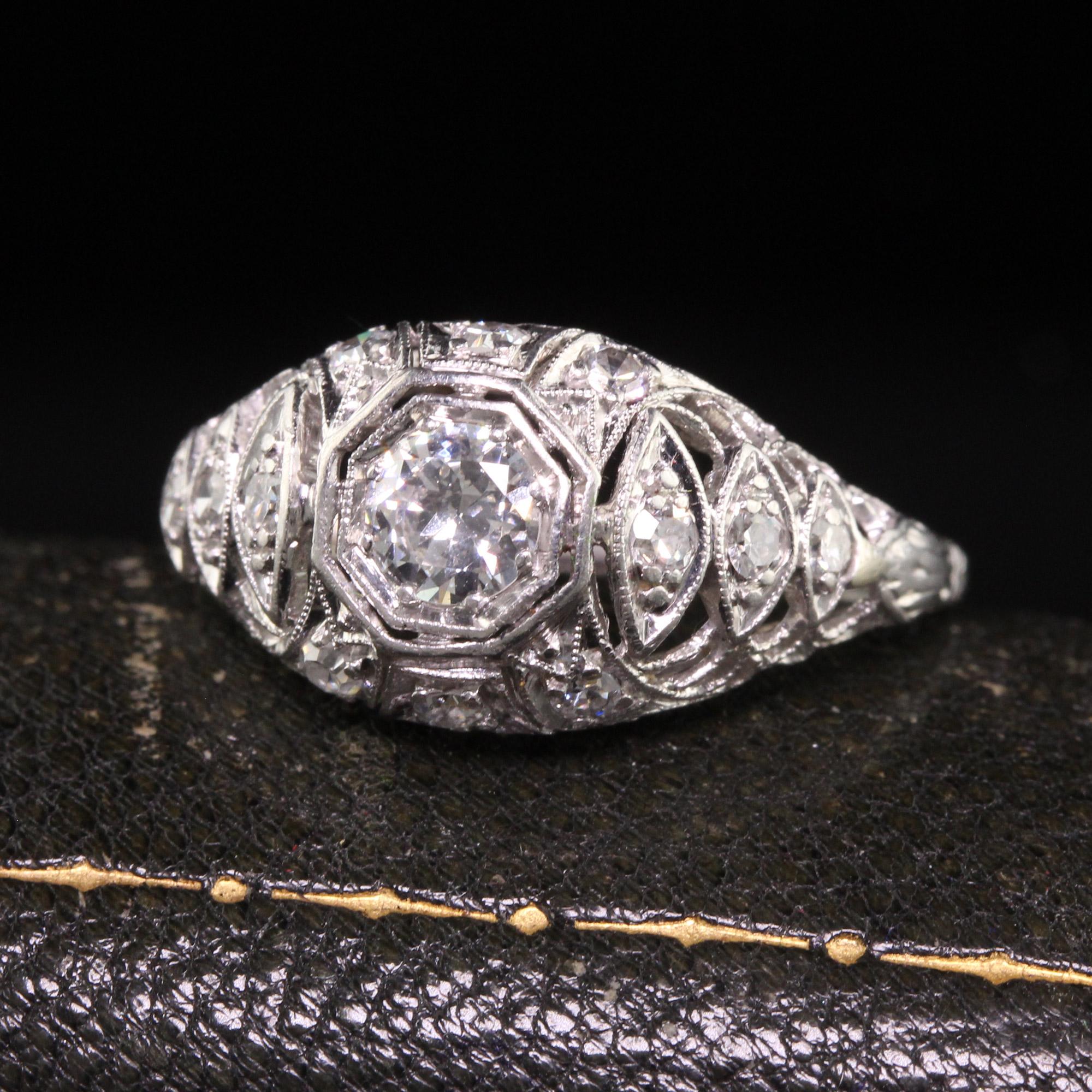 Beautiful Antique Art Deco Platinum Old European Diamond Filigree Engagement Ring. This gorgeous ring is crafted in platinum. The center holds an old european cut diamond in a beautiful filigree mounting. The smaller diamonds are single cut and the