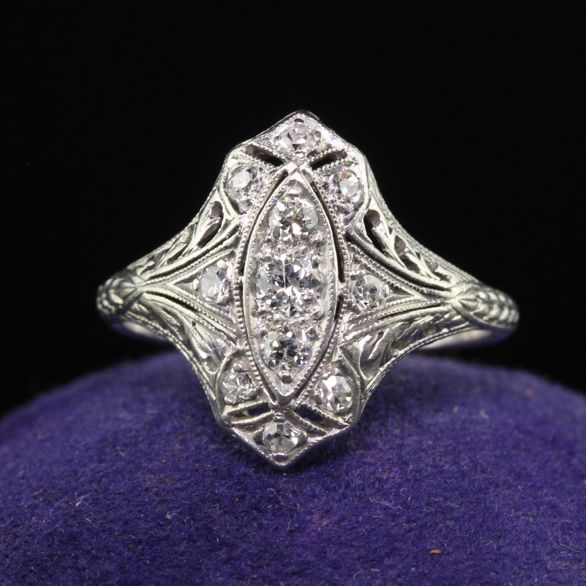 Beautiful Antique Art Deco Platinum Old European Diamond Filigree Shield Ring. This gorgeous art deco shield ring is crafted in platinum. This beautiful ring has old European cut diamonds set on top of an amazing engraved Art Deco mounting. This