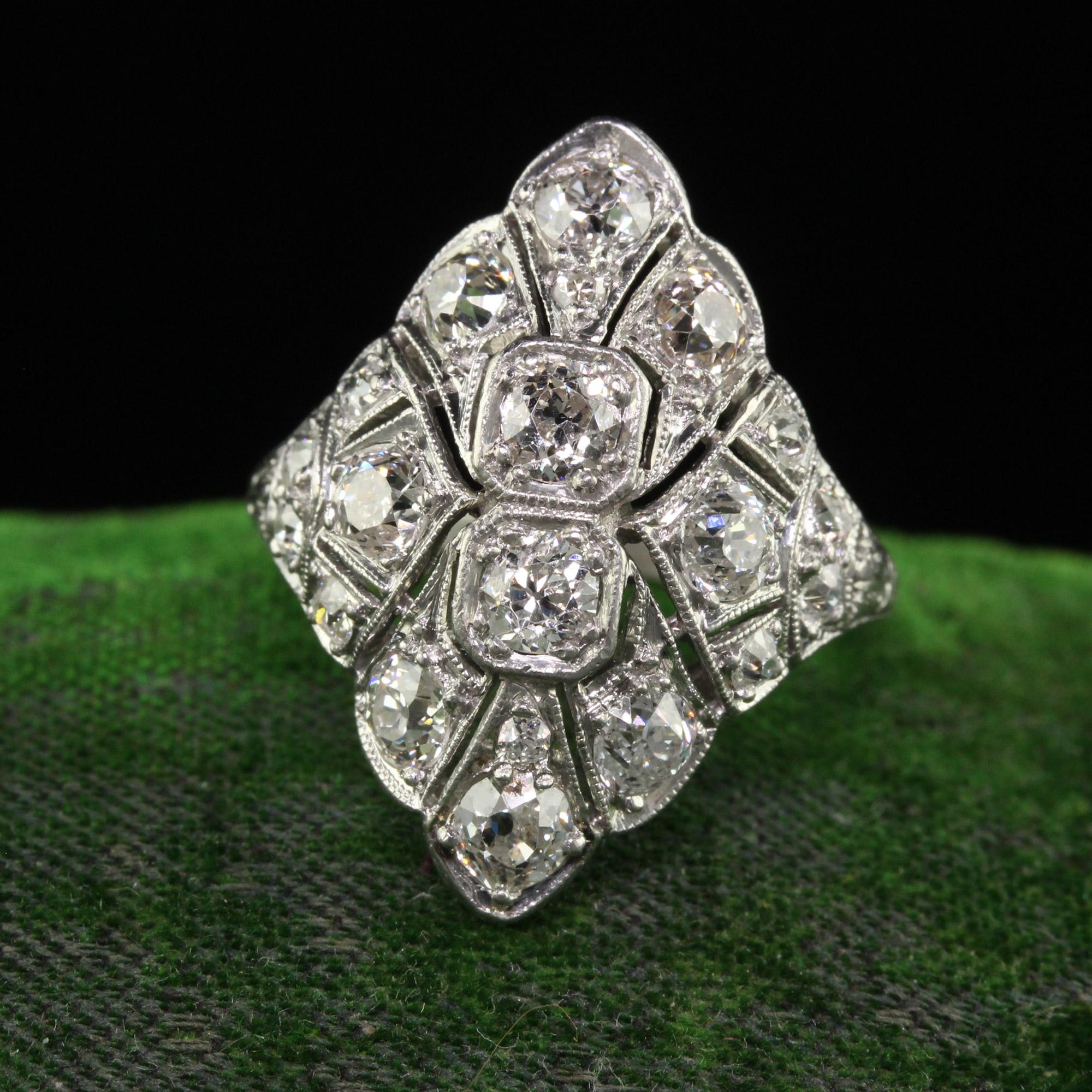 Beautiful Antique Art Deco Platinum Old European Diamond Filigree Shield Ring. This incredible art deco diamond shield ring is crafted in platinum. The top of the ring is set with gorgeous old European cut diamonds in a beautiful Art Deco mounting