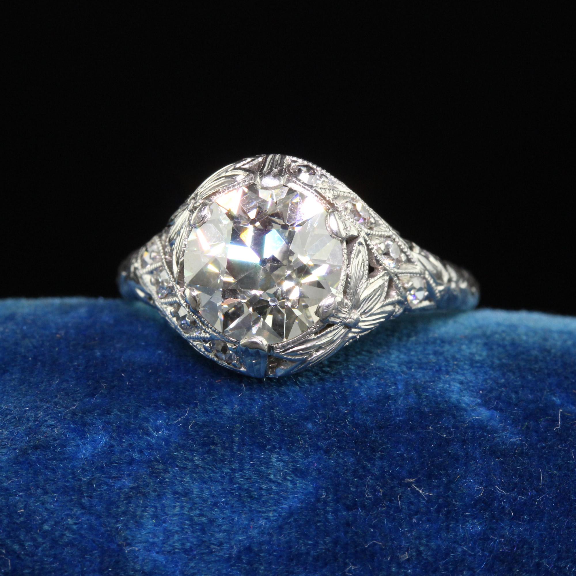 Beautiful Antique Art Deco Platinum Old European Diamond Floral Engagement Ring - GIA. This gorgeous engagement ring is crafted in platinum. The center holds an amazing old European cut diamond that has a GIA report. The mounting has an incredible