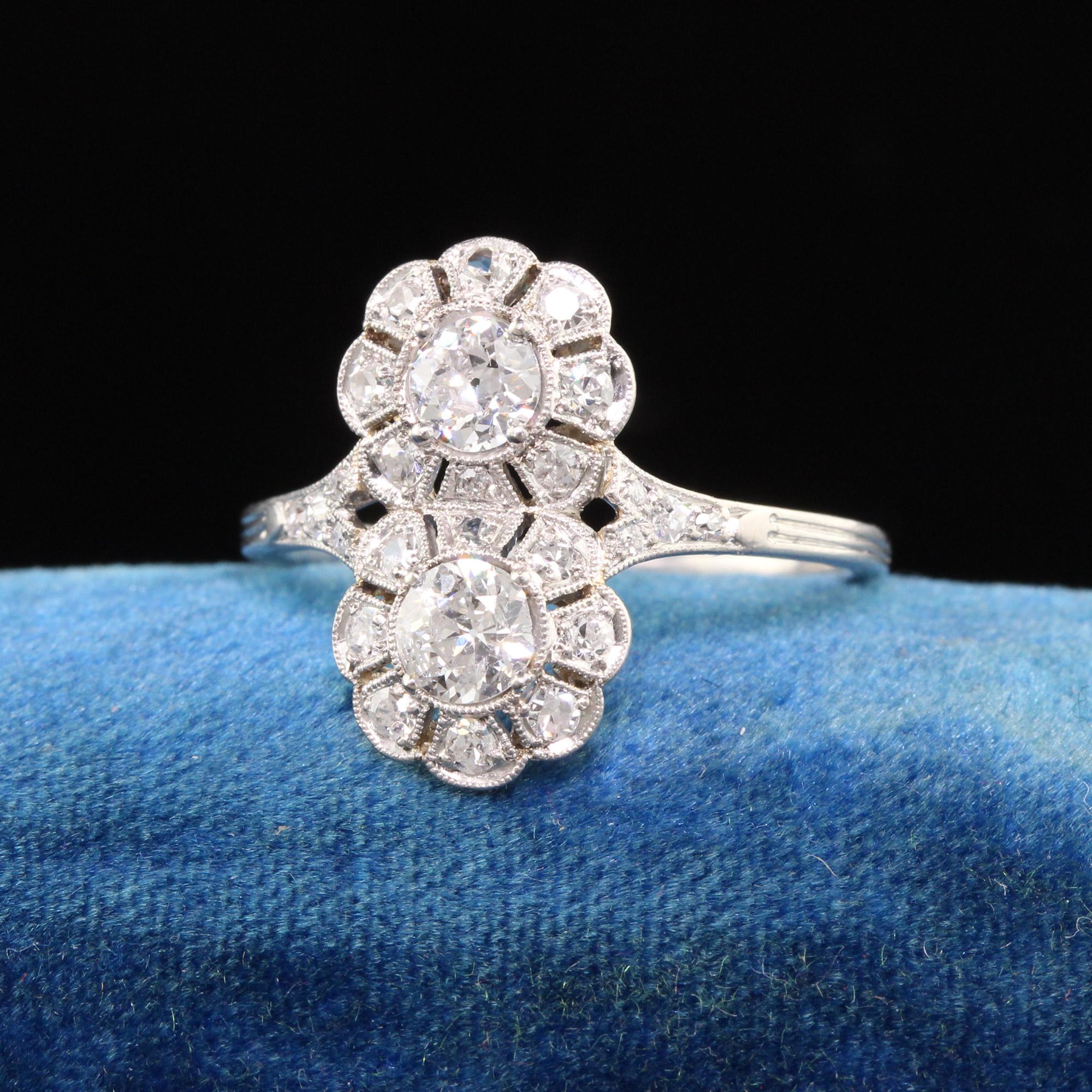 Beautiful Antique Art Deco Platinum Old European Diamond Floral Toi Et Moi Ring. This incredible Toi Et Moi ring features old europeal diamonds in the center of an amazing art deco setting with floral designs.

Item #R1068

Metal: Platinum

Weight: