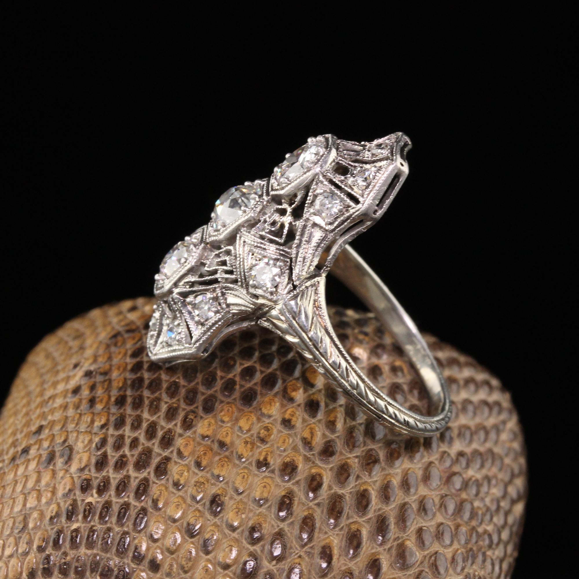 Beautiful Antique Art Deco Platinum Old European Diamond Shield Ring. This pristine Art Deco shield ring has over 1 ct of diamonds on it with incredible filigree work. The engravings are untouched and the ring hasn't been sized.

Item #R0901

Metal:
