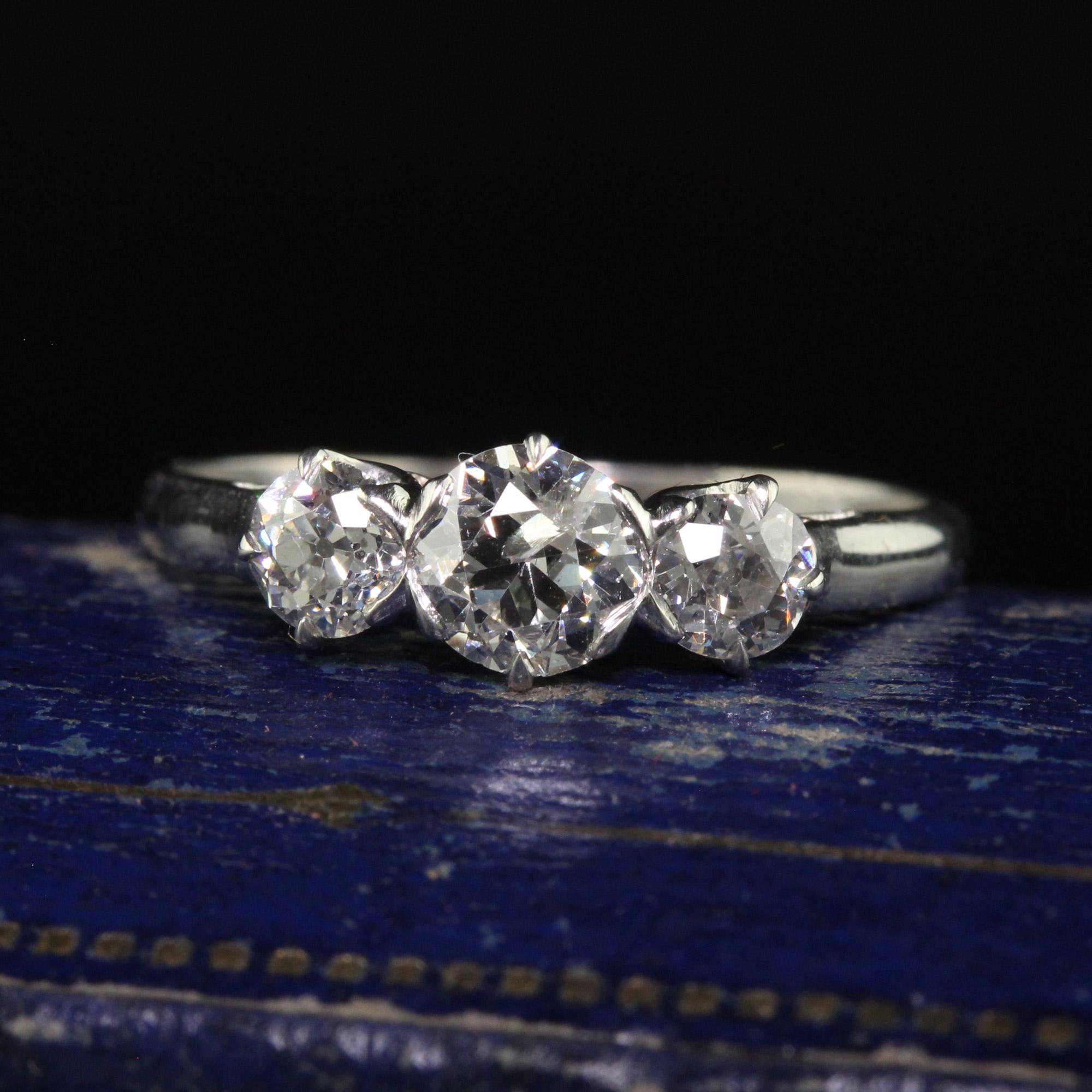 Beautiful Antique Art Deco Platinum Old European Diamond Three Stone Ring. This gorgeous three diamond ring is crafted in platinum. The ring holds three old European cut diamonds on top and is set in a gorgeous Art Deco mounting with a beautiful