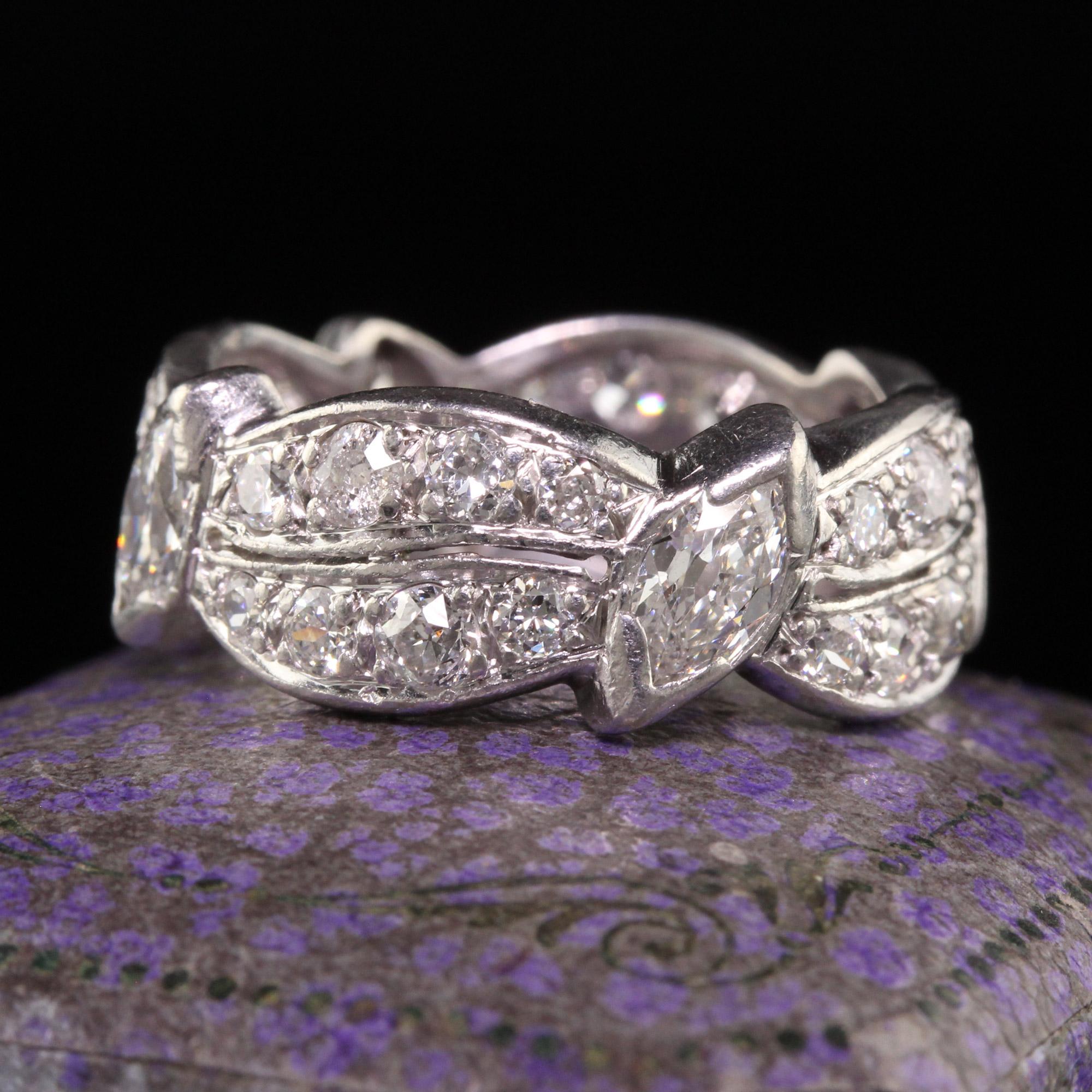 Beautiful Antique Art Deco Platinum Old European and Marquise Eternity Band - Size 6 3/4. This incredible eternity ring is crafted in platinum. This beautiful ring has old european cut diamonds set around the entire band. There are two stations