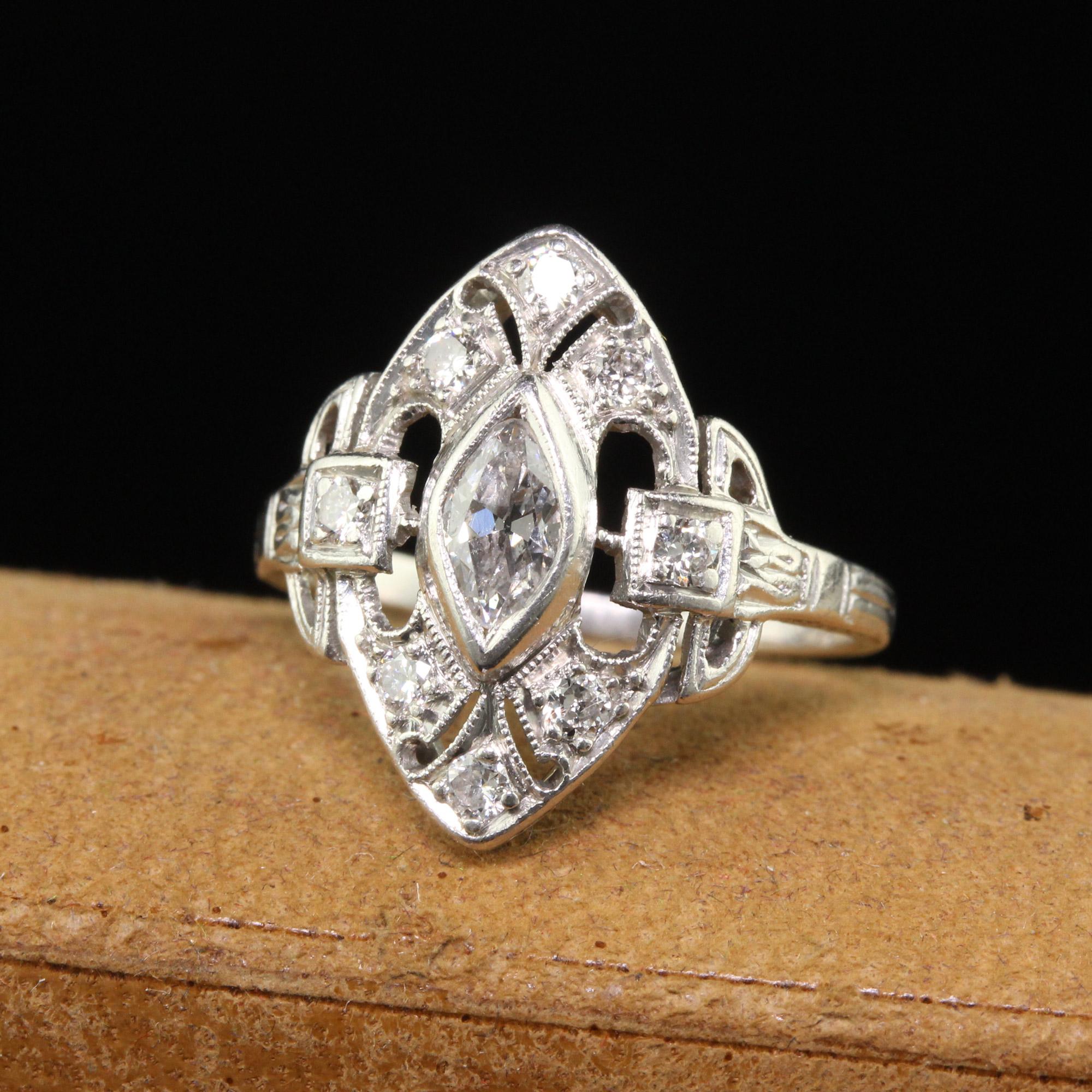 Beautiful Antique Art Deco Platinum Old Marquise Diamond Filigree Shield Ring. This gorgeous ring is crafted in platinum. The center holds an old marquise cut diamond and is surrounded by old European cut diamonds. The ring is in good condition and