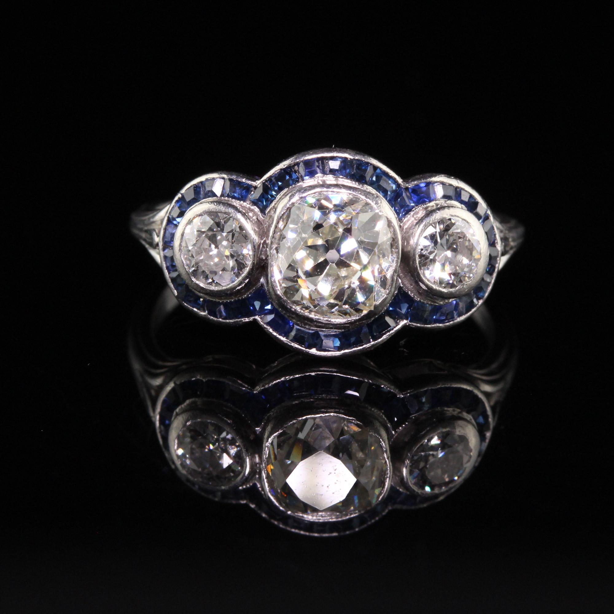 Antique Art Deco Platinum Old Mine Diamond and Sapphire Three Stone Ring In Good Condition For Sale In Great Neck, NY