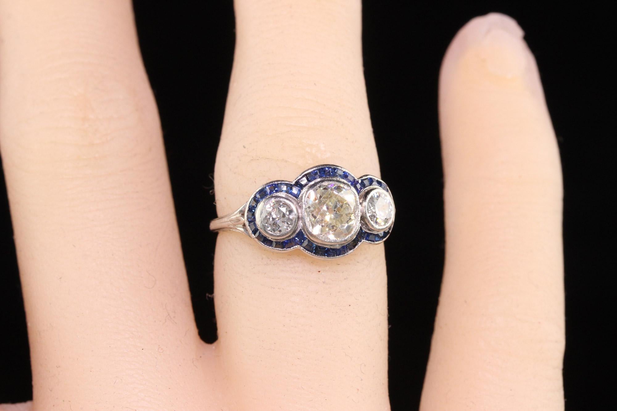 Antique Art Deco Platinum Old Mine Diamond and Sapphire Three Stone Ring For Sale 2