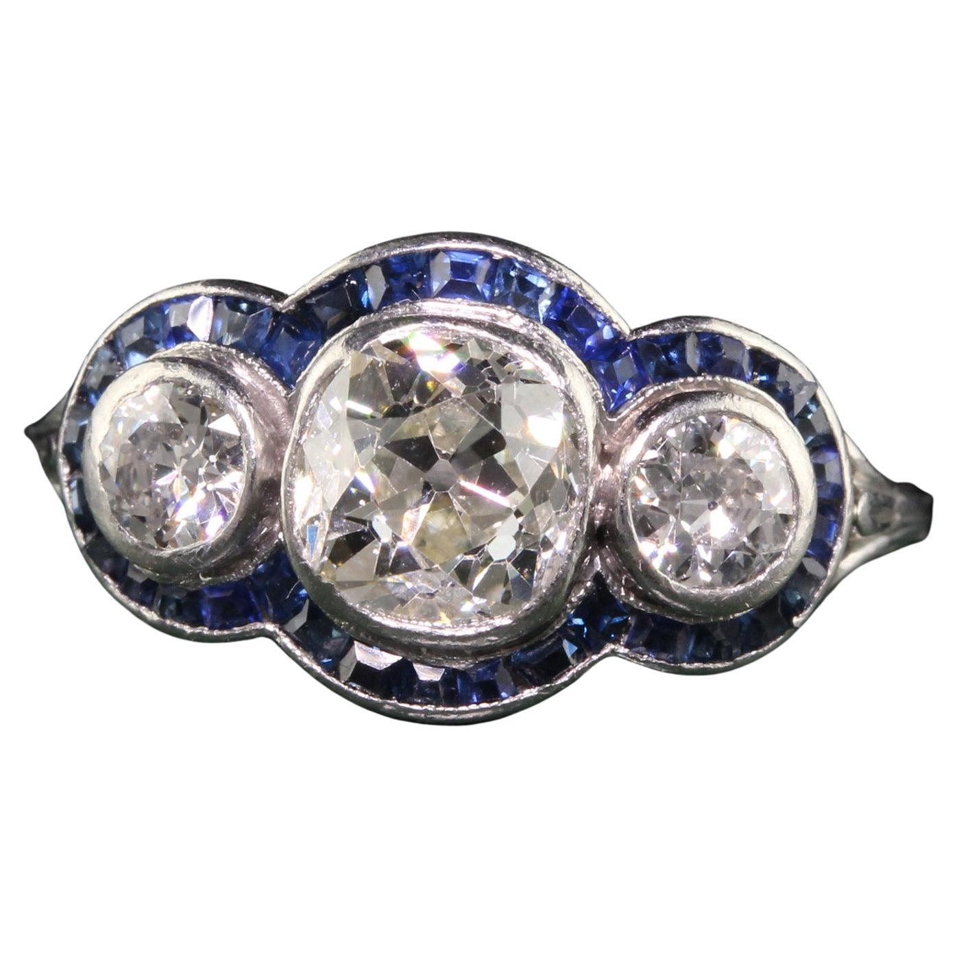 Antique Art Deco Platinum Old Mine Diamond and Sapphire Three Stone Ring